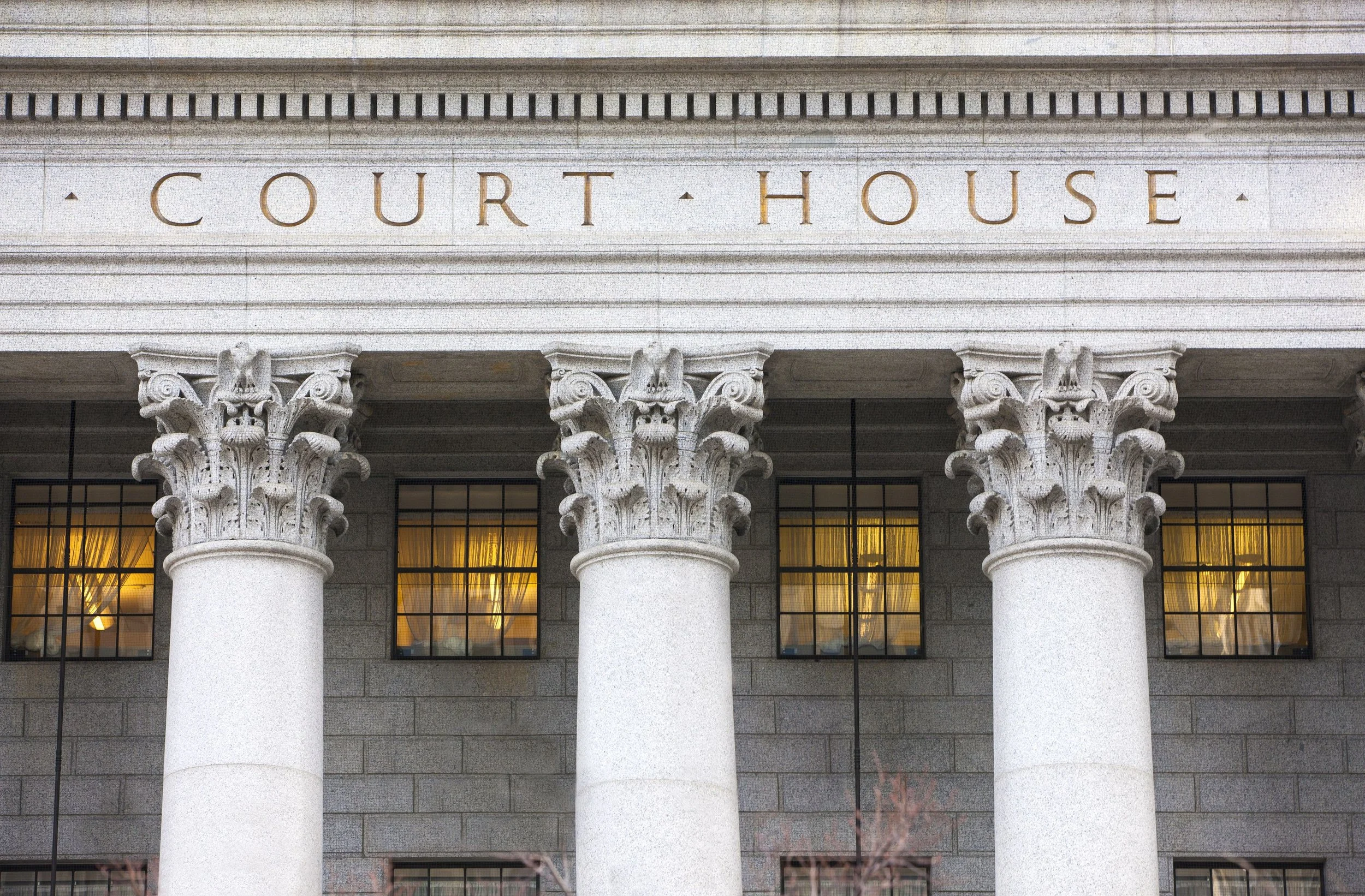 Facade of courthouse with columns law Legal.jpeg