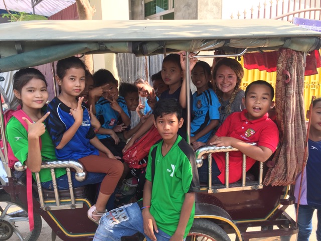 Jessica and some of the children on a tuk-tuk enrollee to a stake Khmer New Year celebration.