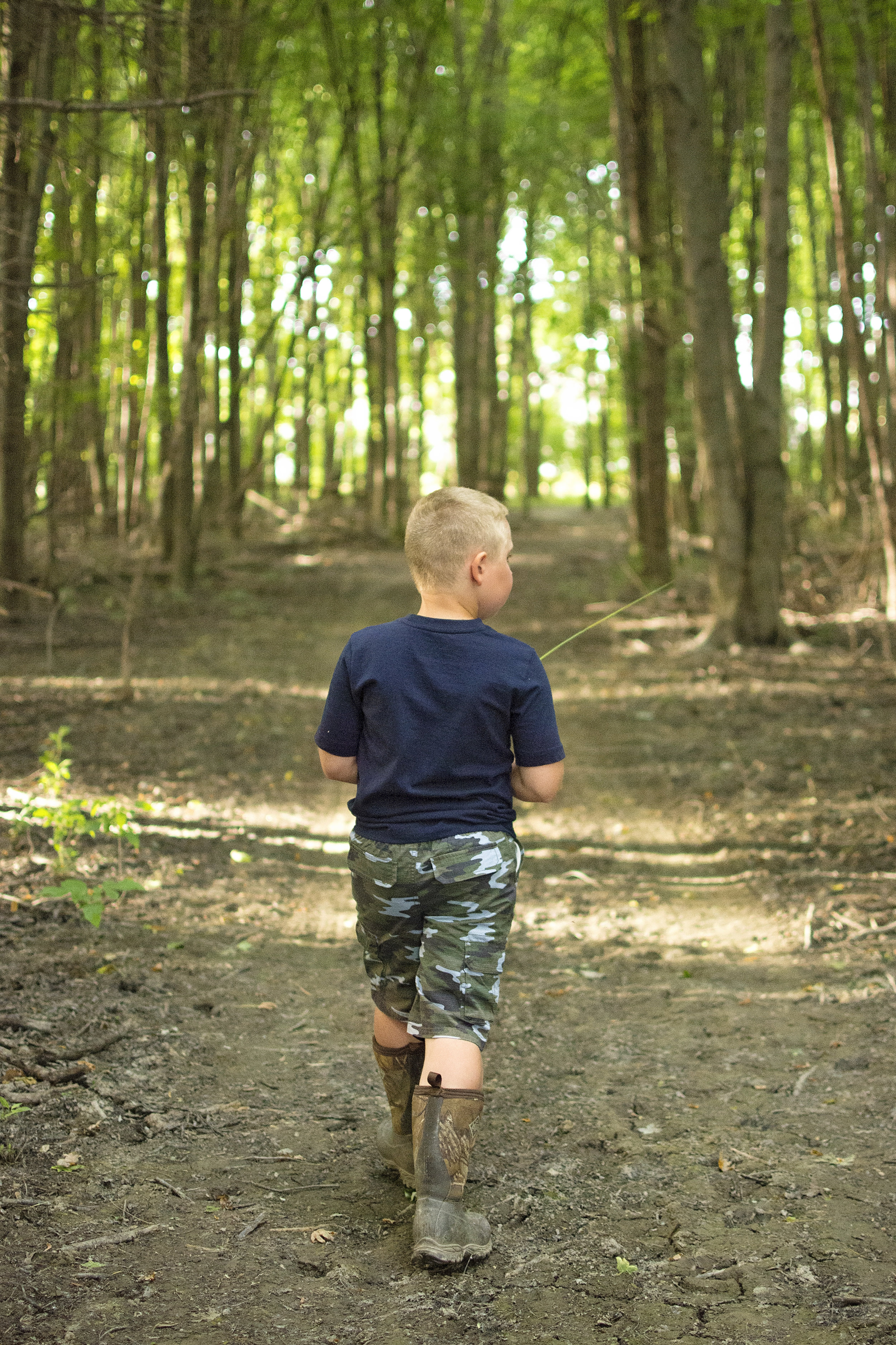One of Braedan's favorite things to do, exploring the woods.