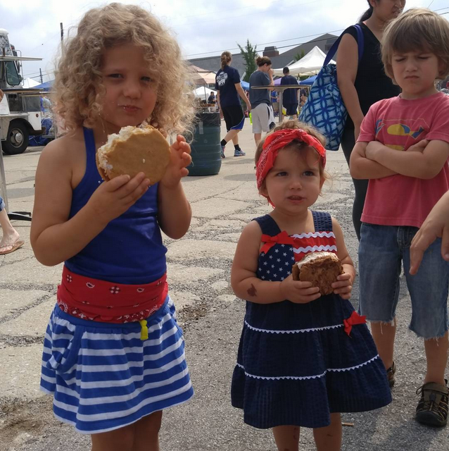Can you tell which unhappy looking kid didn't get an ice cream sandwich of his own? 