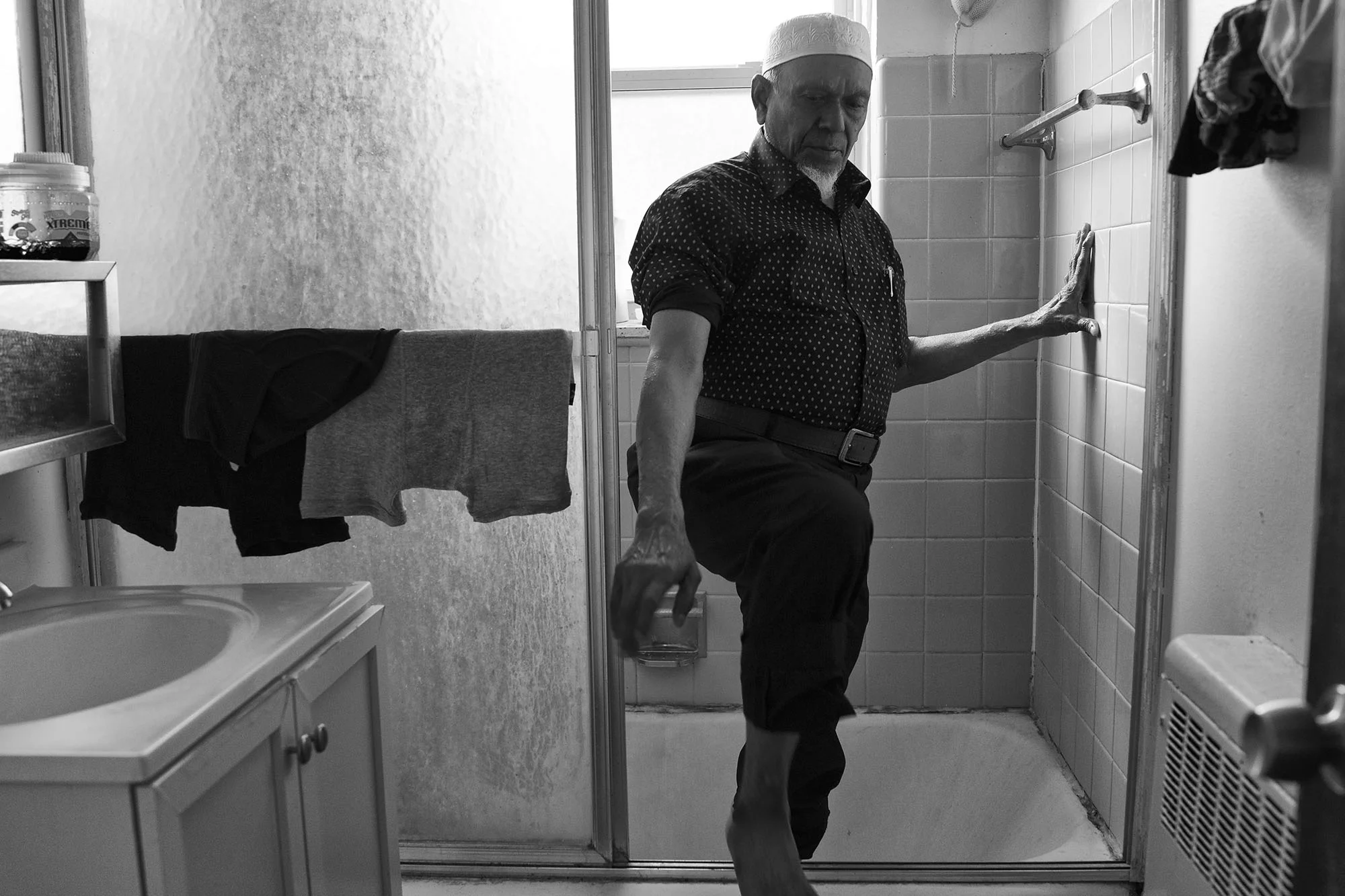 Mohammed cleans up for evening prayer. He arrived Chicago in 2014. In Chicago, he feels a strengthened sense of community with his fellow Rohingya and Muslim neighbors. “I didn’t have this opportunity in Burma.” 