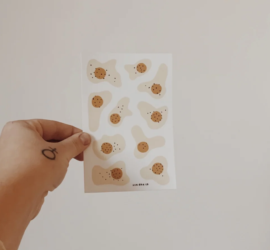 Rani Ban Sunny Side Up Sticker Sheet in hand.png