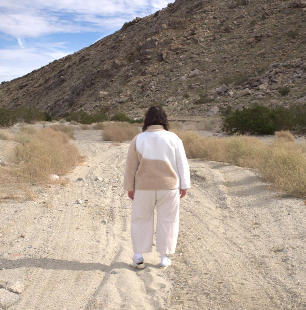 Gron Kulle Yang Zip Up Beige and Off White back far away.png