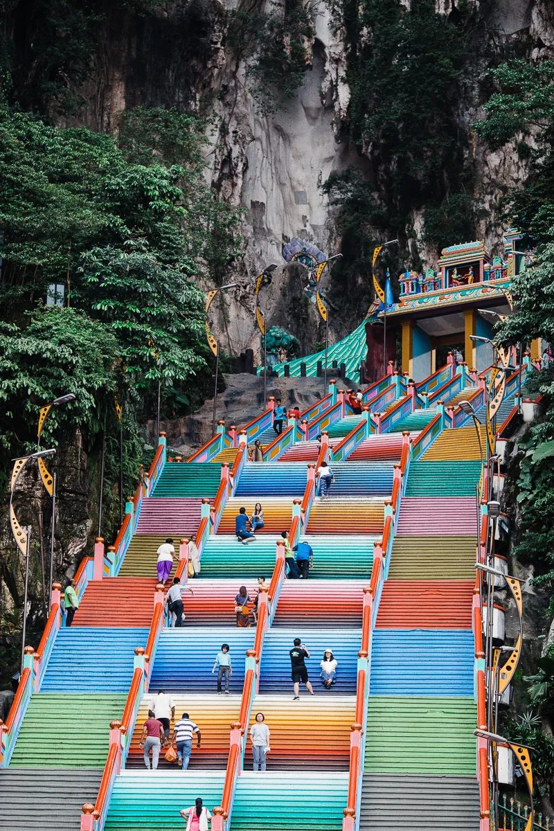 The colorful stairs at Batu Caves, leading up towards the temple by Kuala Lumpur photographer Erica Knecht.