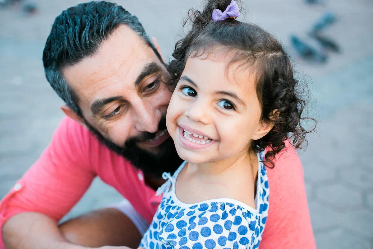 A father embraces his daughter in a family photoshoot by KL photographer Erica Knecht.