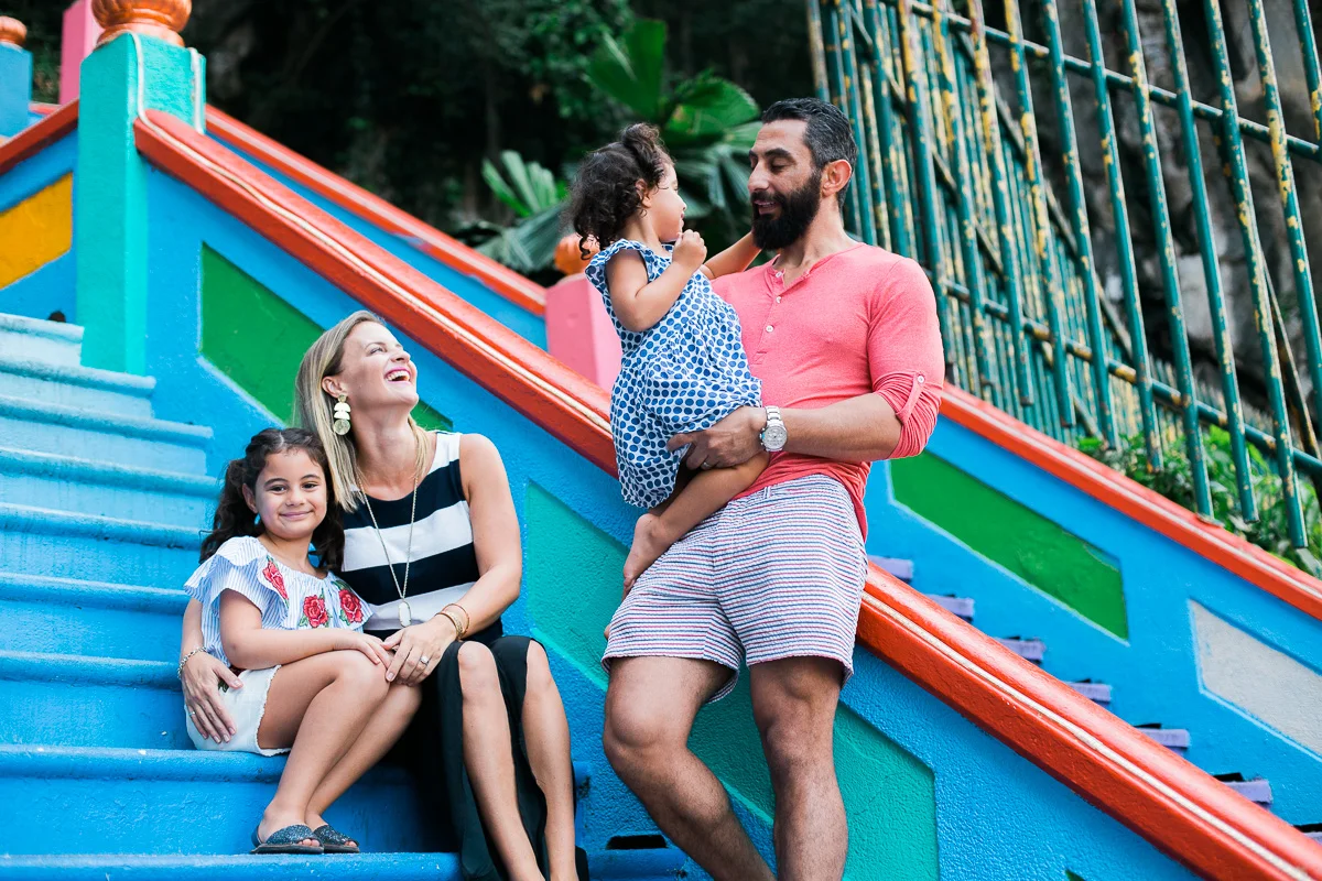 A family portrait on the steps of Batu Caves in Kuala Lumpur by Erica Knecht