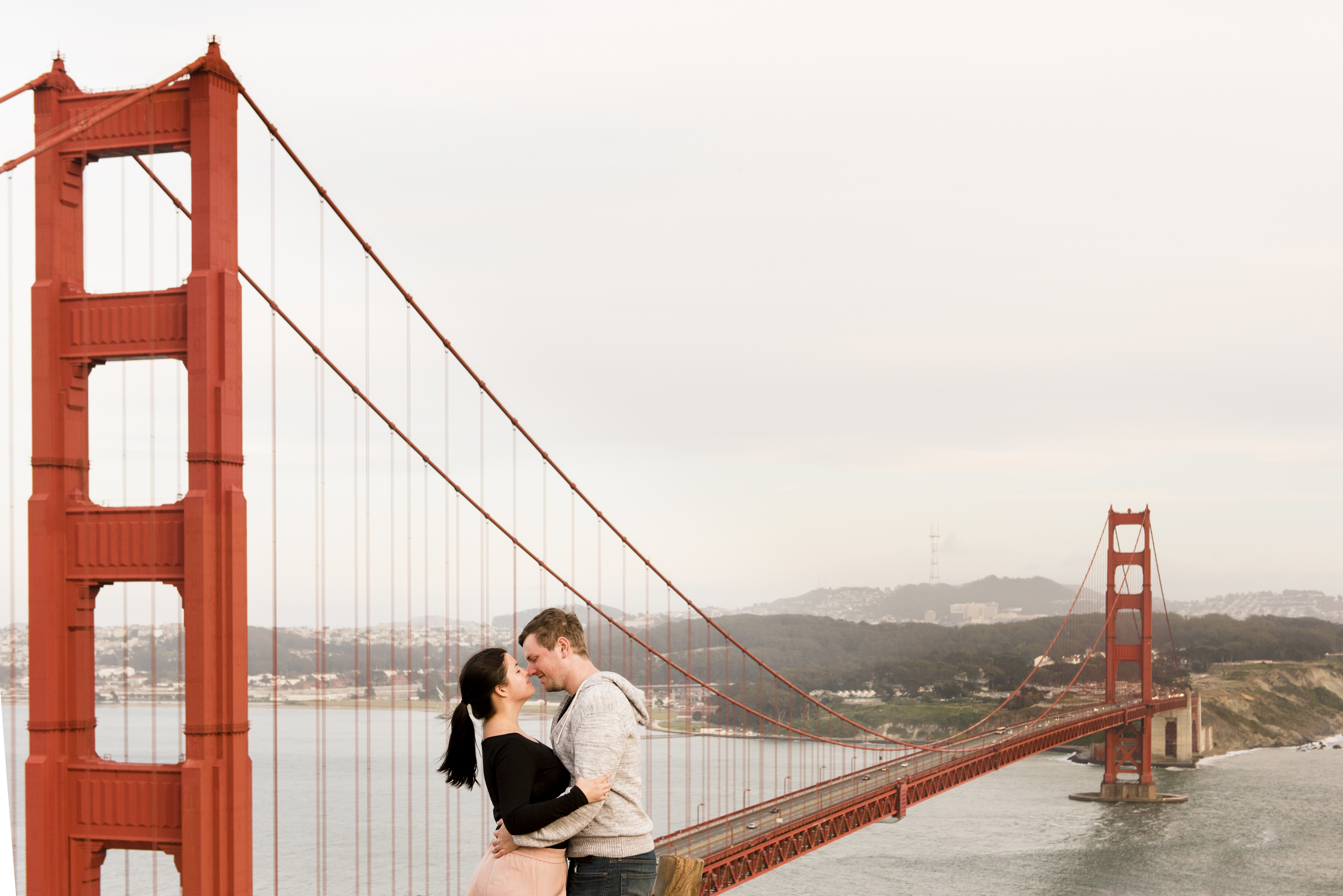 couple standing by bridge