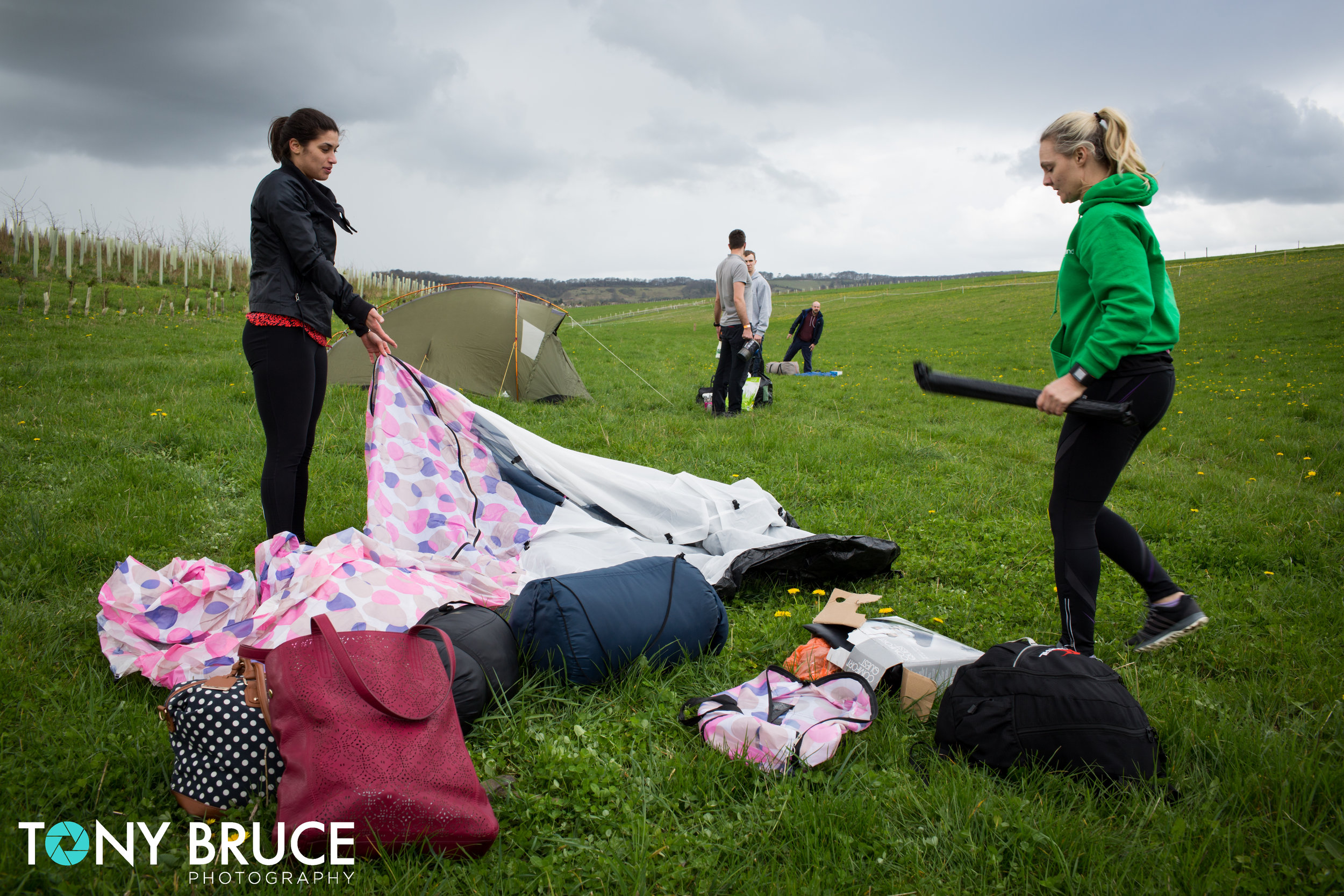 Georgiana Robitu and Nicky Wilding set up camp before the rain came.