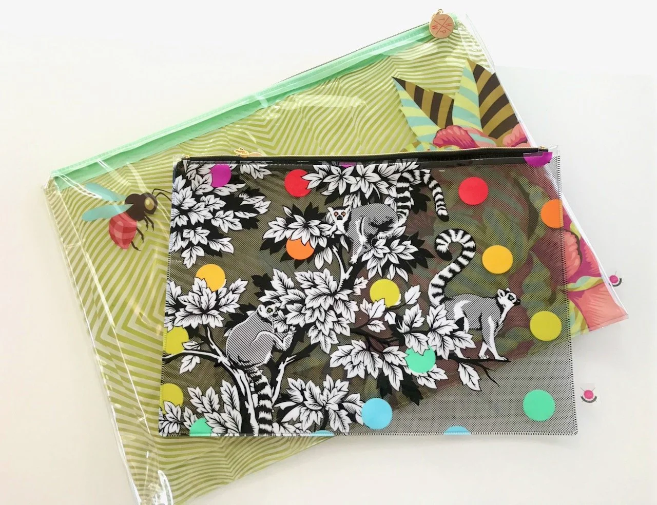 An A3 (behind) and and A4 (in front) PVC Tula Pink project bag