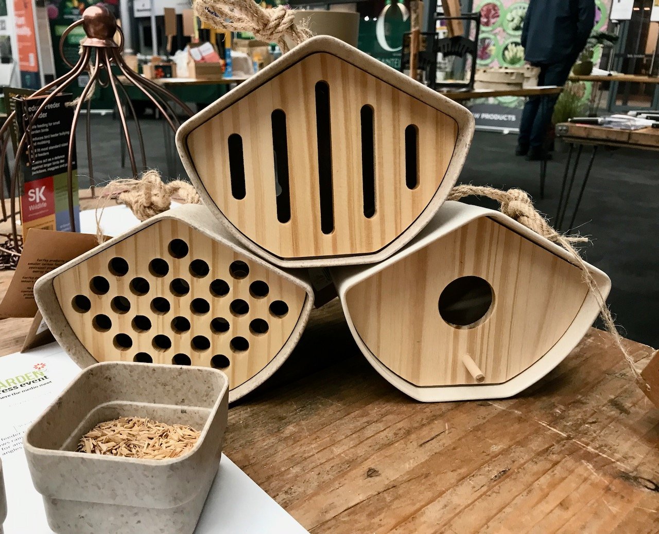 A stack of sustainable bird, bee and butterfly houses
