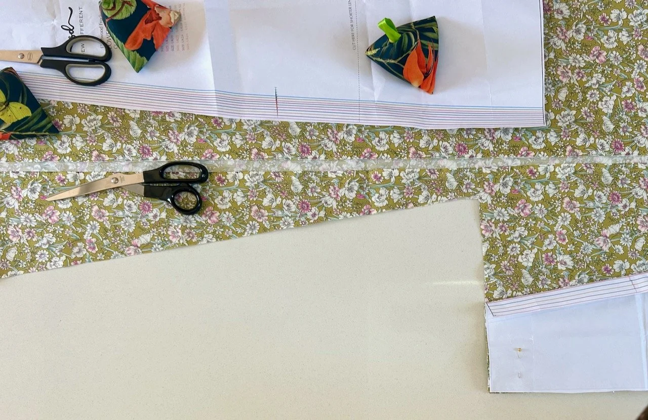 Looking down on the pattern laid out and the first piece cut