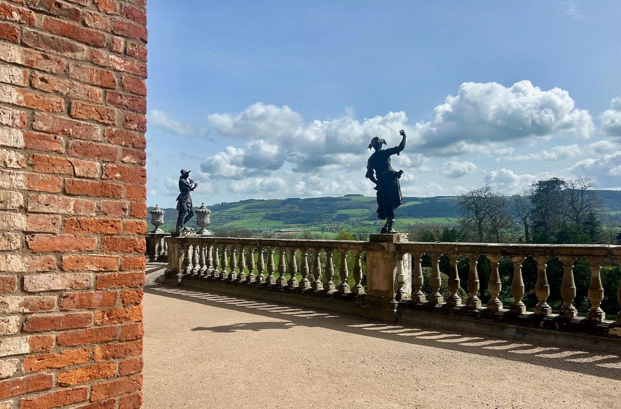 Statues on the balustrade - I like to think they're cheering the view!