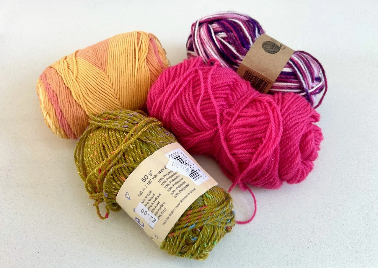 four balls of wool - 50p each