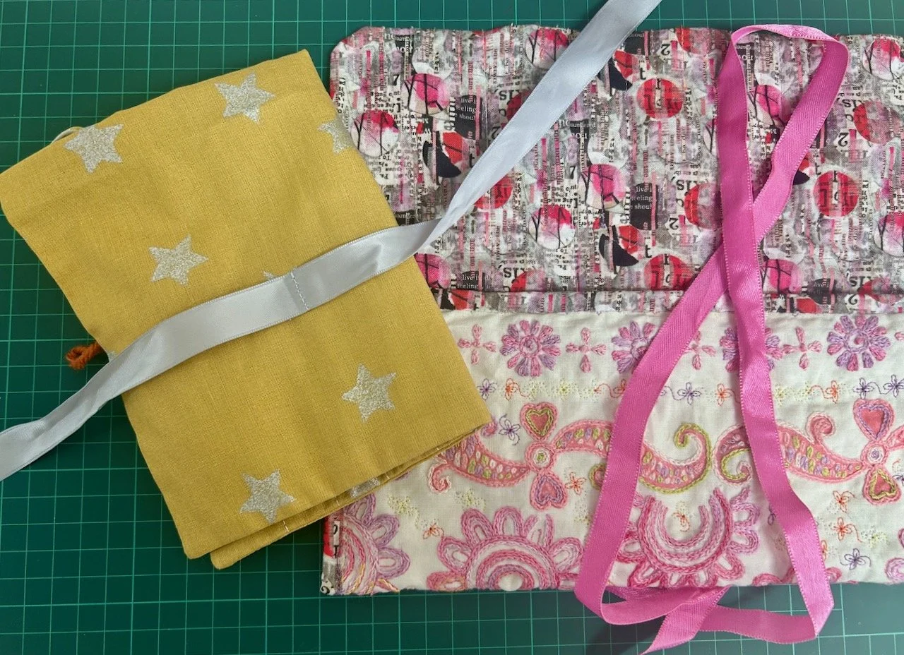 Taking inspiration from my crochet hook pouch - and settling on the pink ribbon