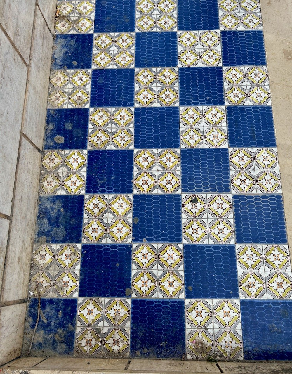 A chequerboard of patterned tiles