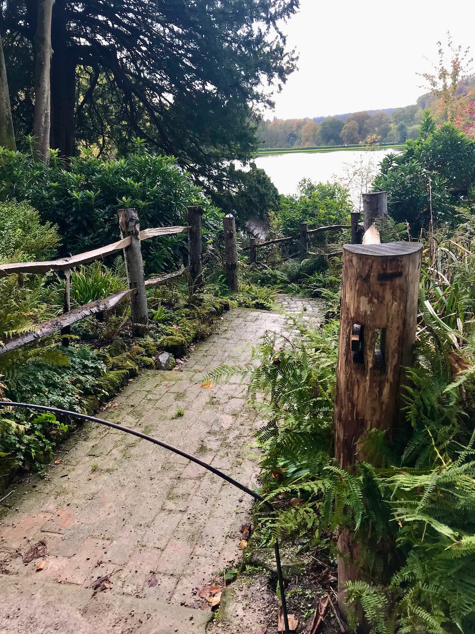 A brick path, stepped leading to who knows where, the lake in the distance