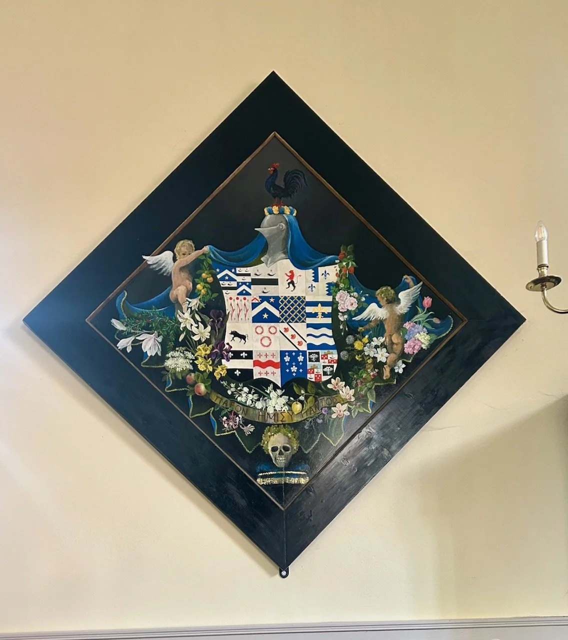 An ornate funeral hatchment displayed on the wall in the church at Flintham