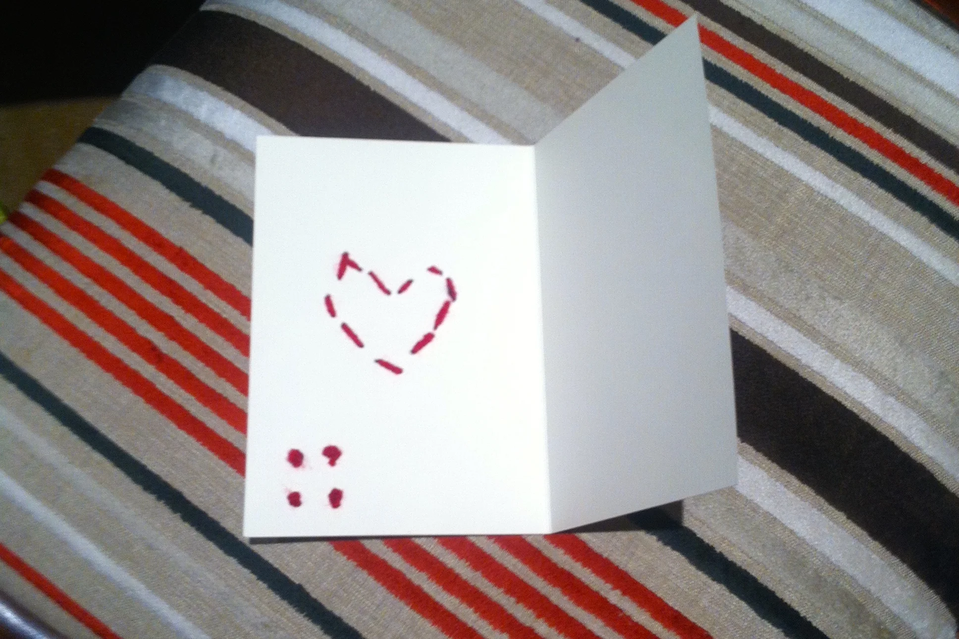 I like the detail of the running stitch heart visible on the inside of the card