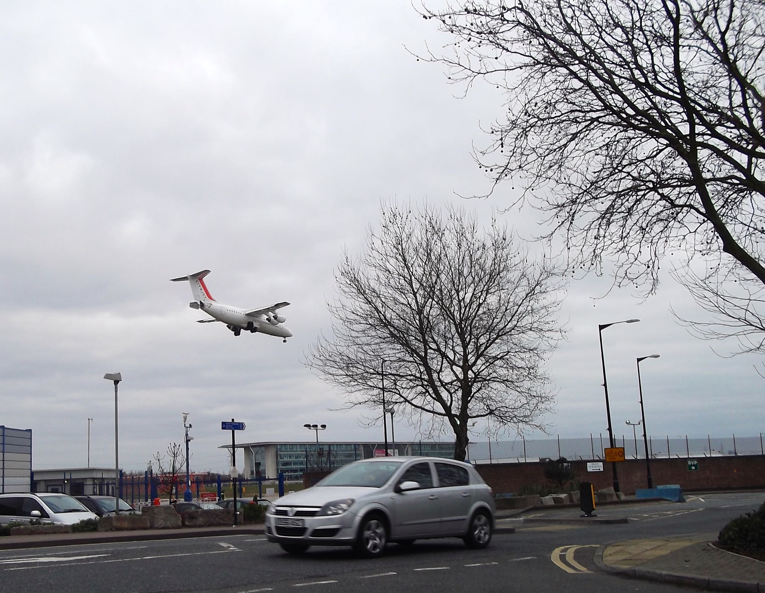 A PLANE LANDING AT CITY AIRPORT