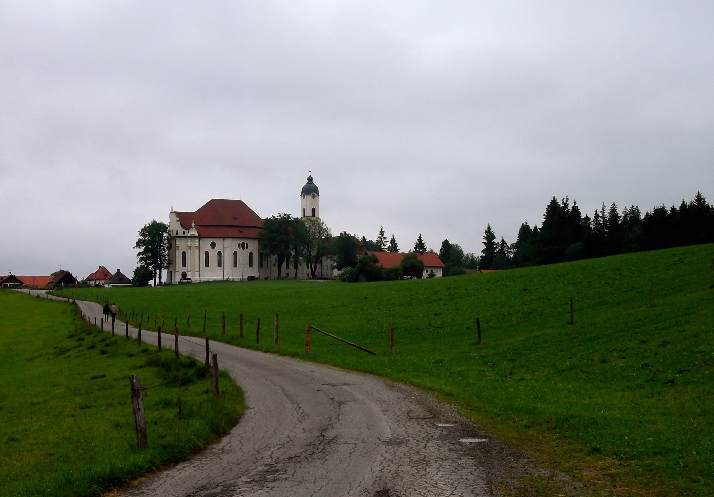 VIEW OF THE WIESKIRCHE EMERGING FROM THE WOODS