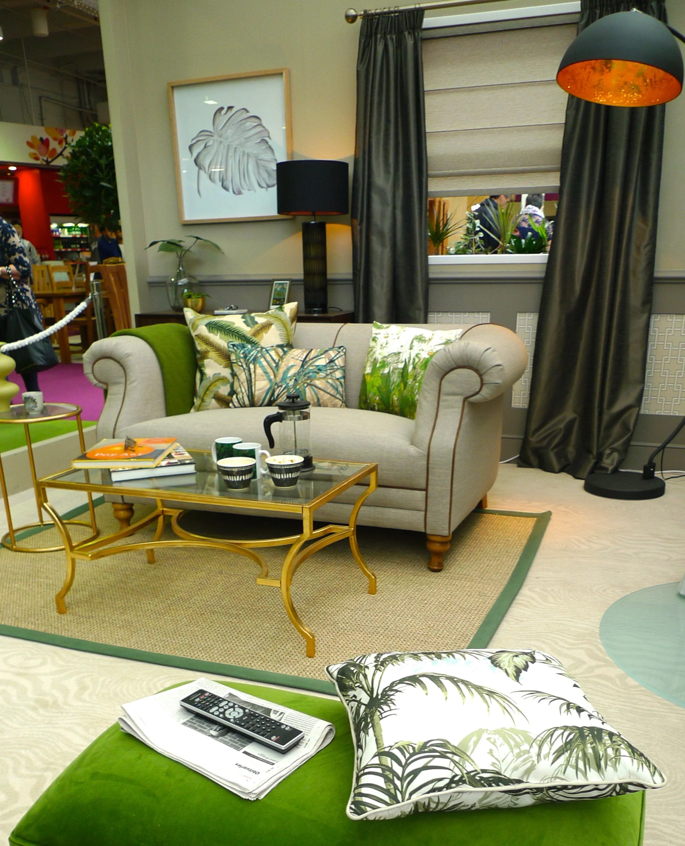 grey sofa and brass tables