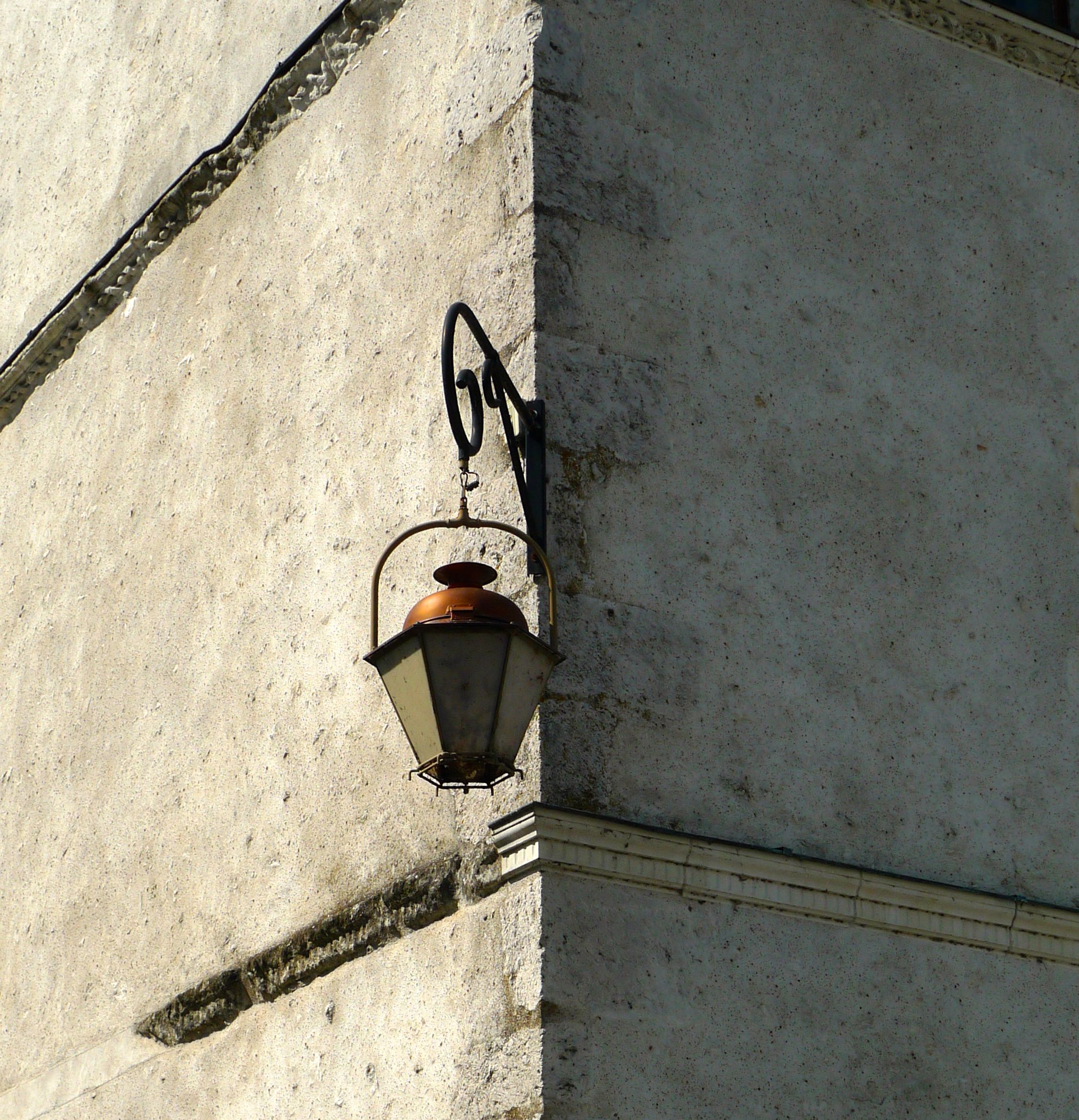 A lantern on the corner of the building