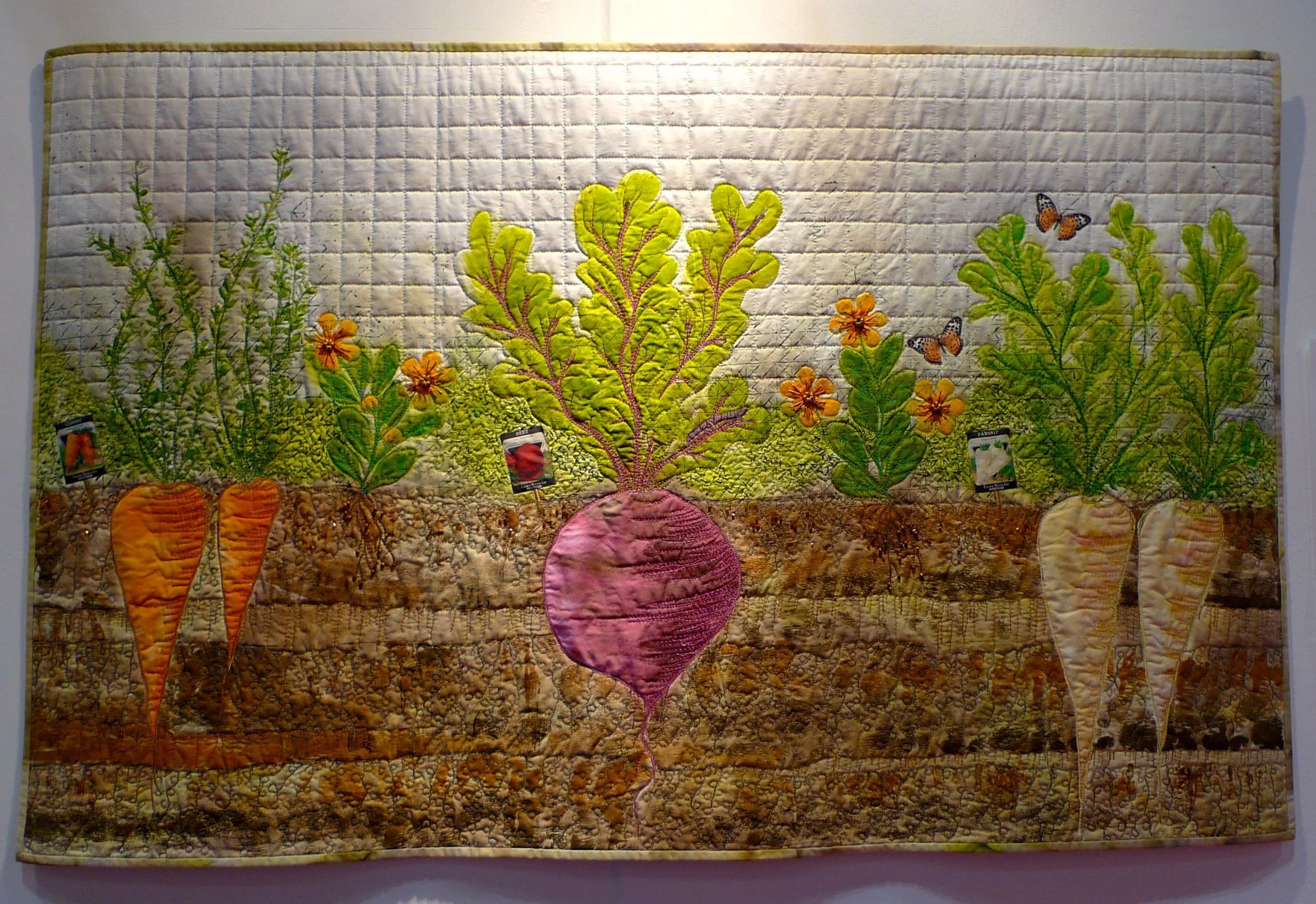 Beetroot, carrots and parsnips on a quilt