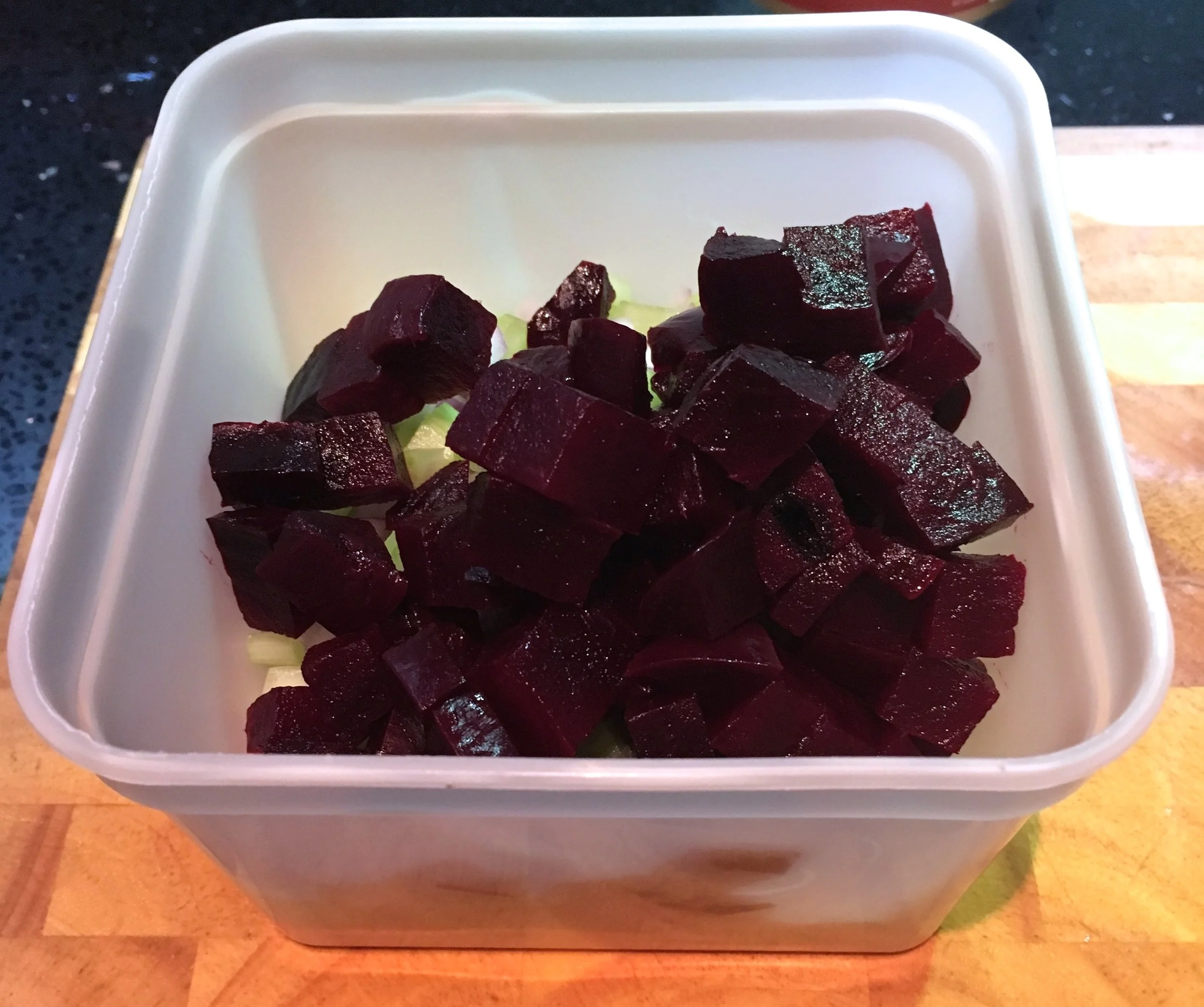 Add the chopped ingredients to a storage container