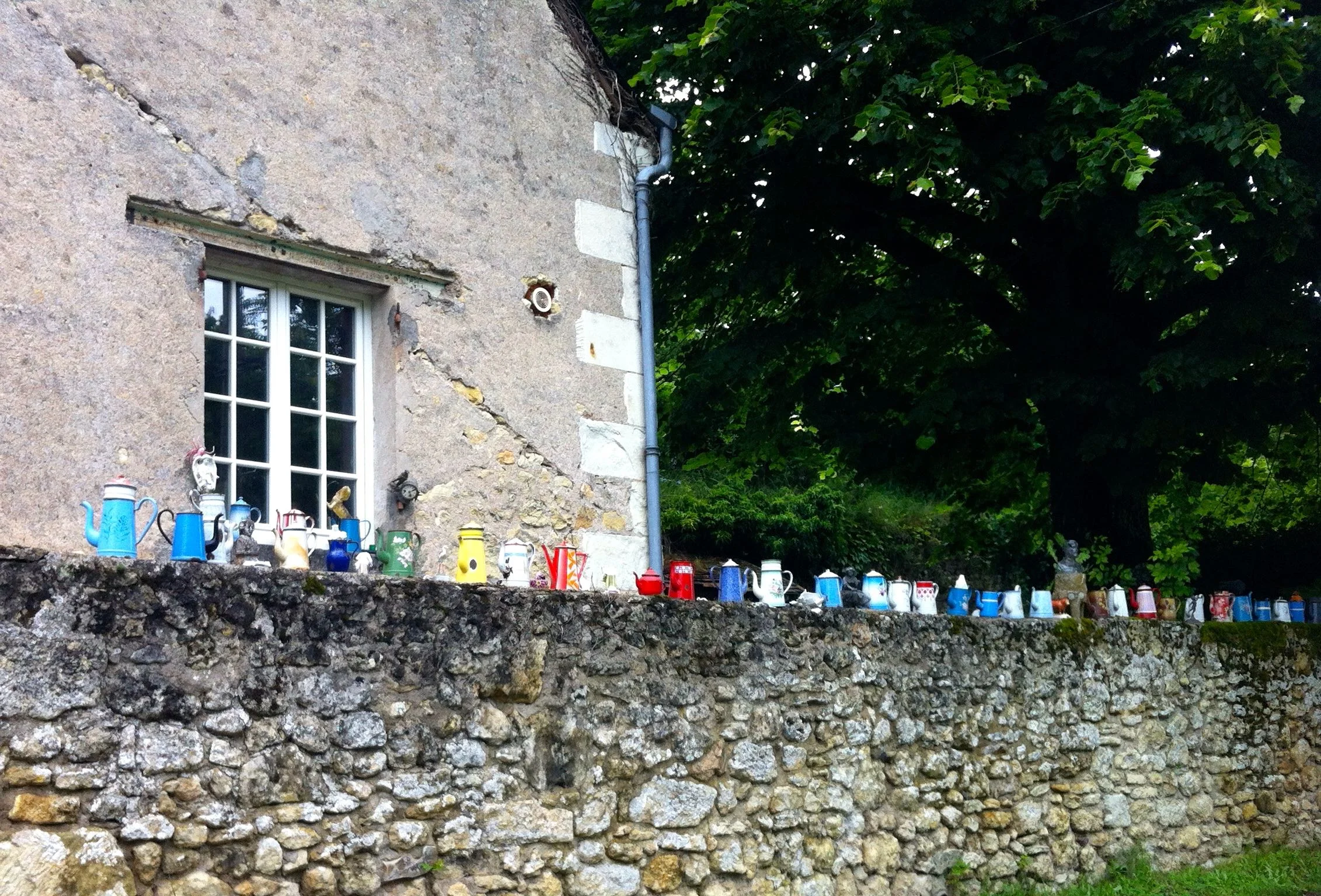 Cycling along the coloured top of the wall caught my eye, and I wondered what it was decorated with