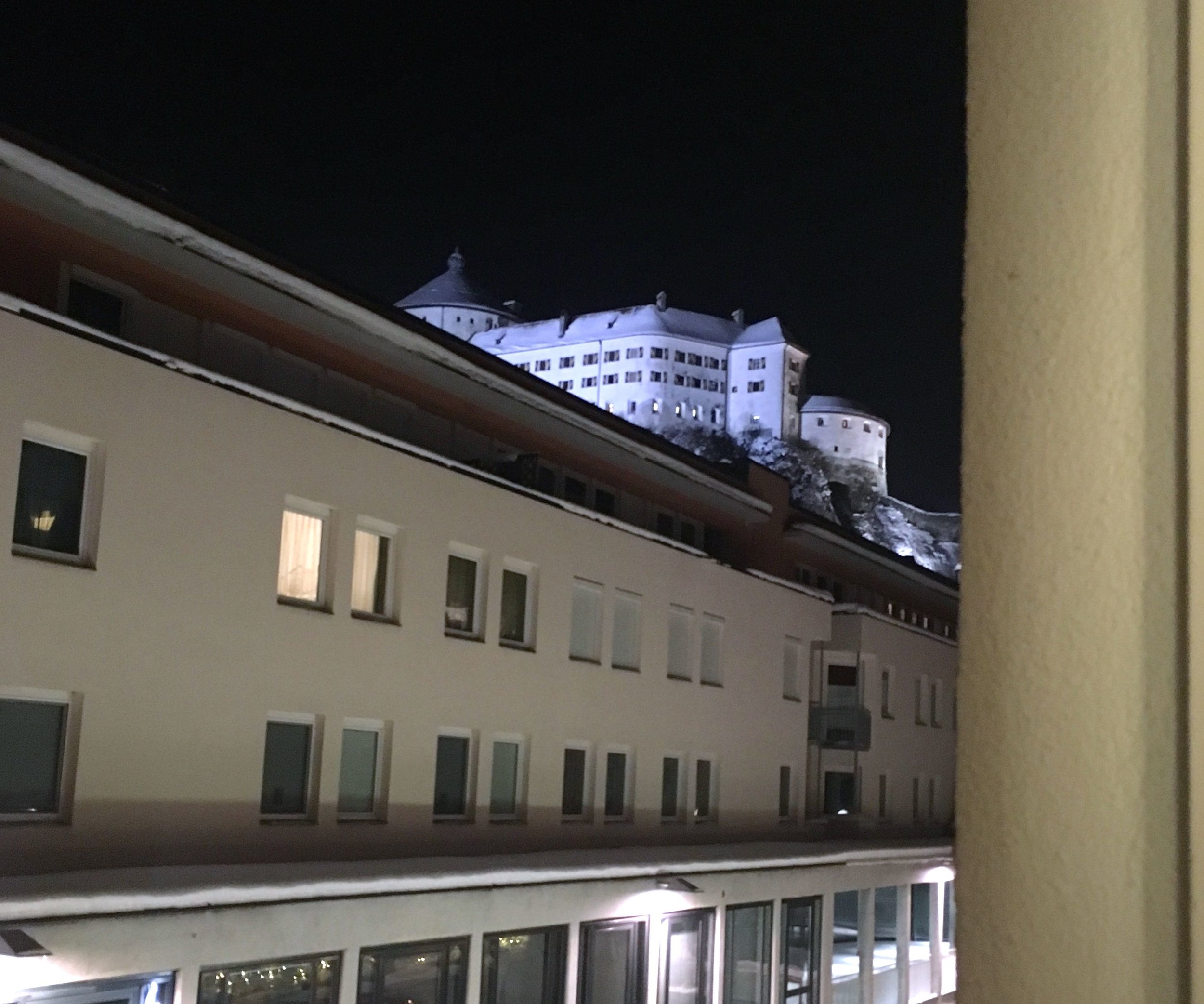 The view out of the window at night towards the Fortress at Kufstein