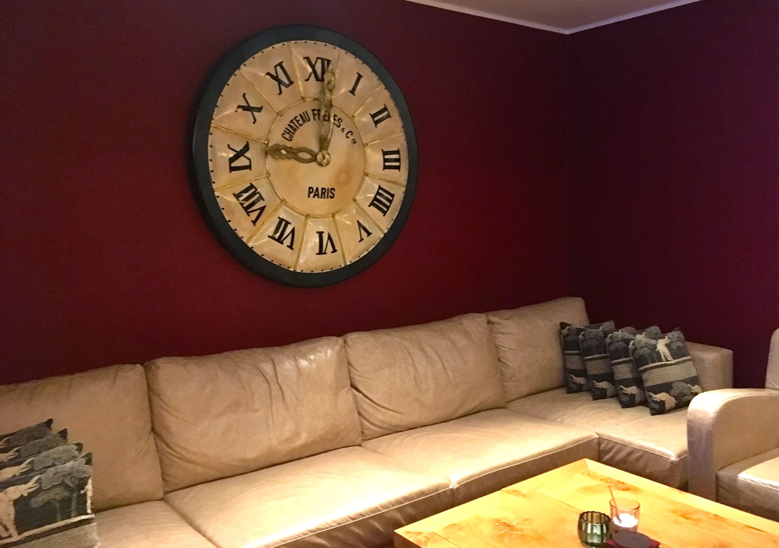 Comfy sofas and an oversized clock in one part of the hotel bar
