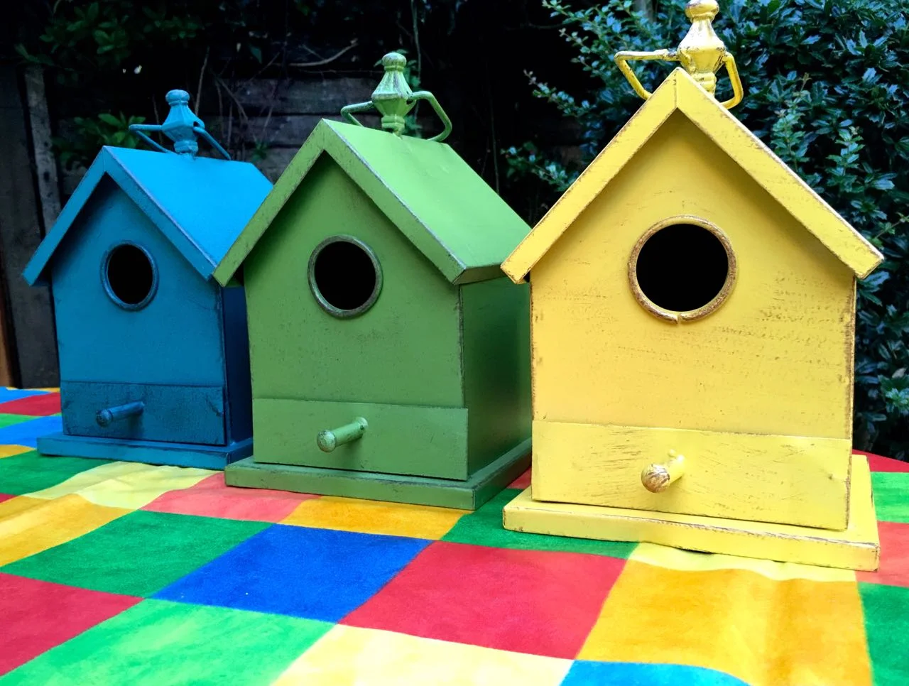 A colourful "estate" of bird houses from HomeSense ready to be deployed in the garden