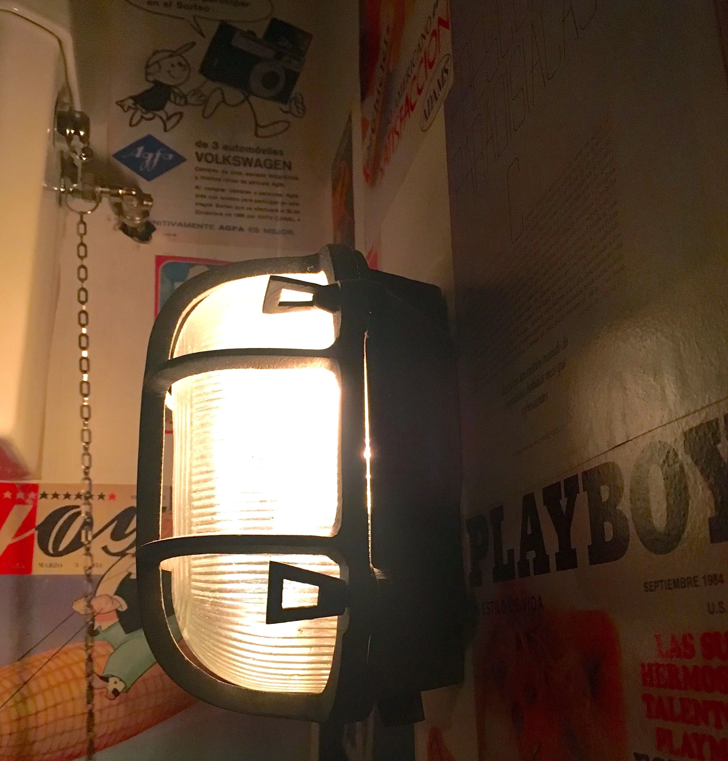 Industrial lighting and magazine covers in the El Pastor loos at Borough Market