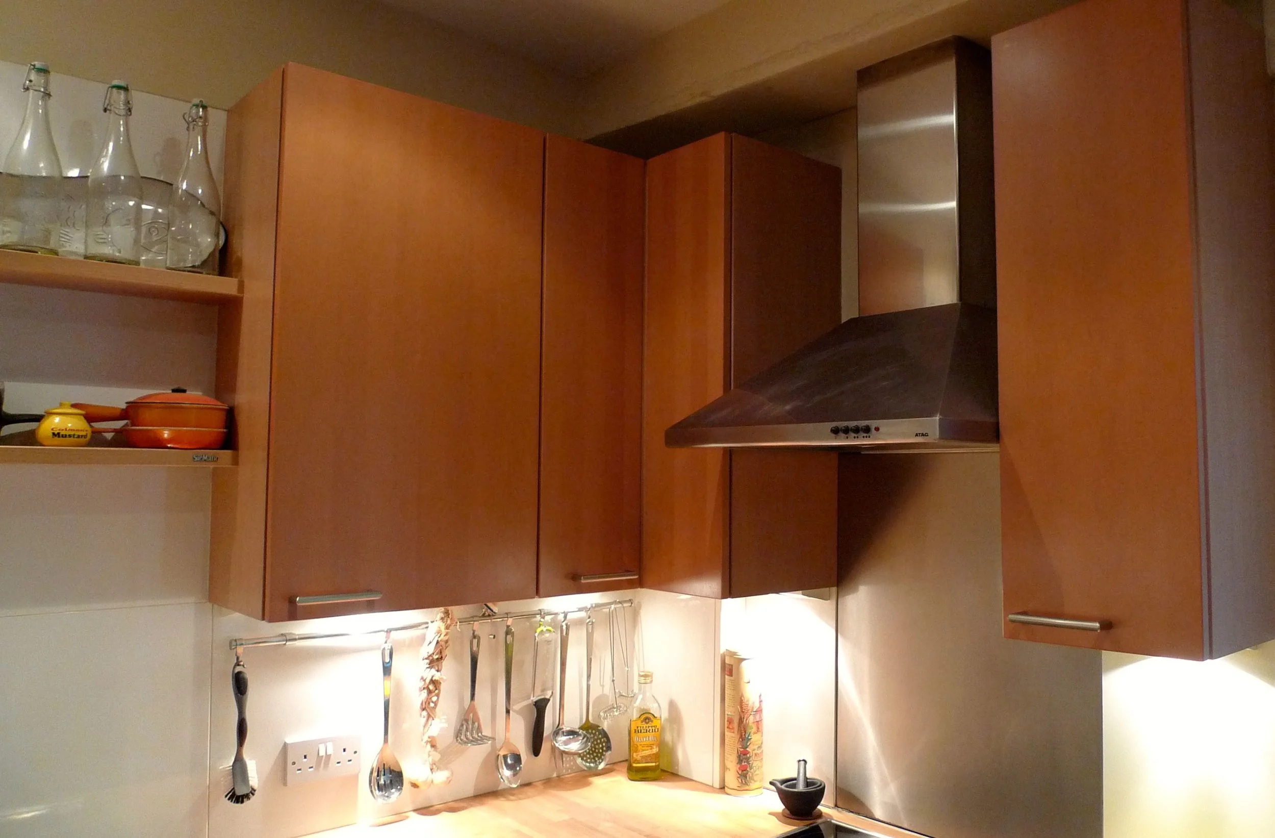 Cherry wood wall units and the chrome cooker hood