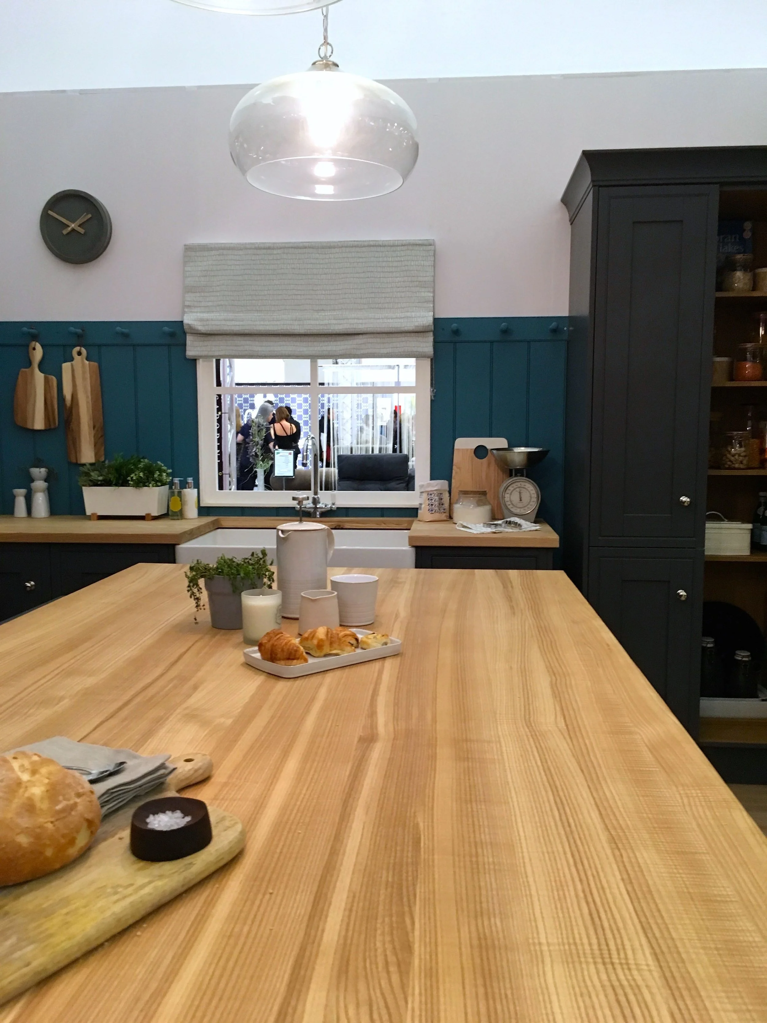 A large central island in the kitchen roomset at the ideal home show