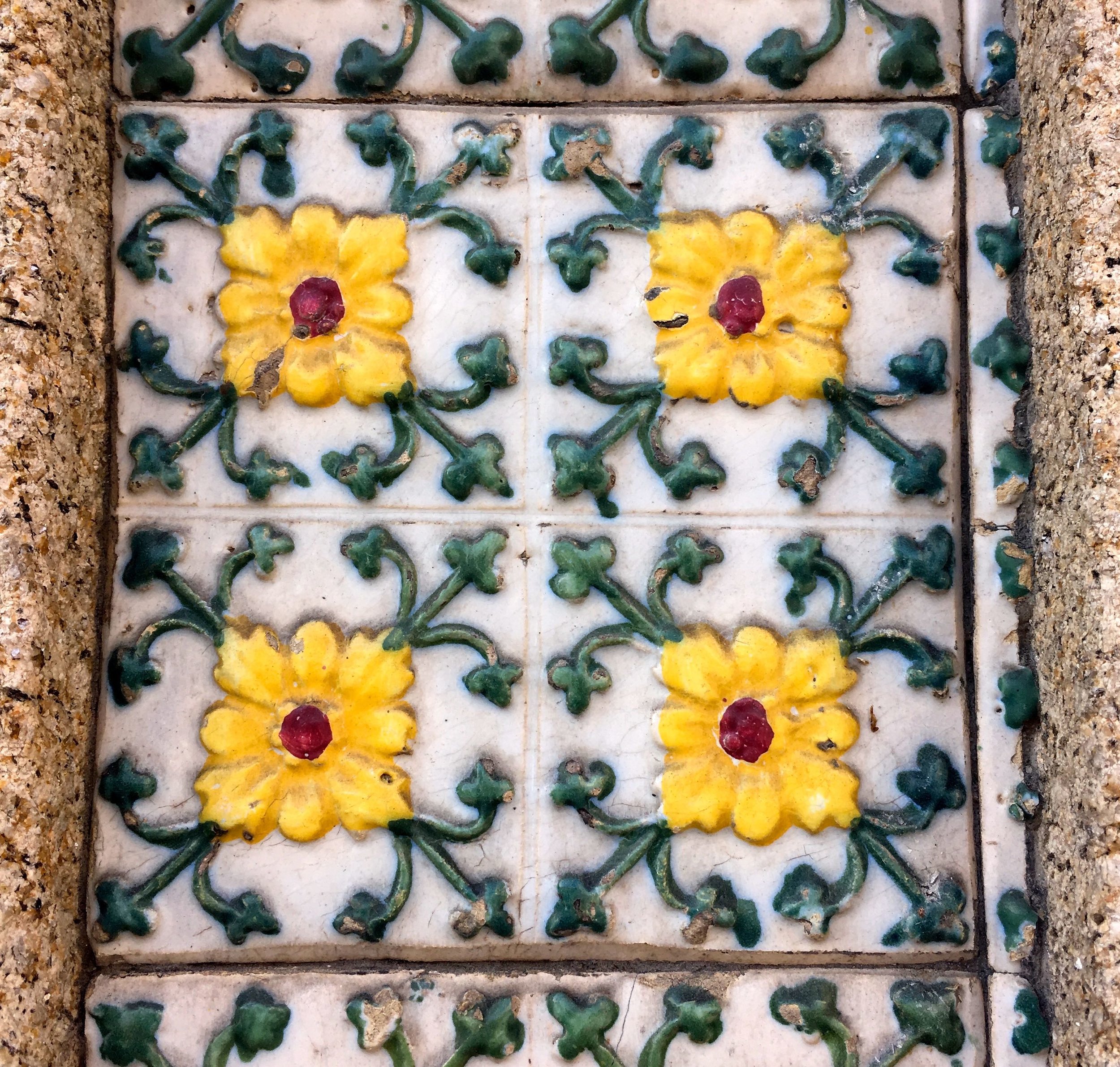 Delicate patterns but a bit battered -  tiles in Porto