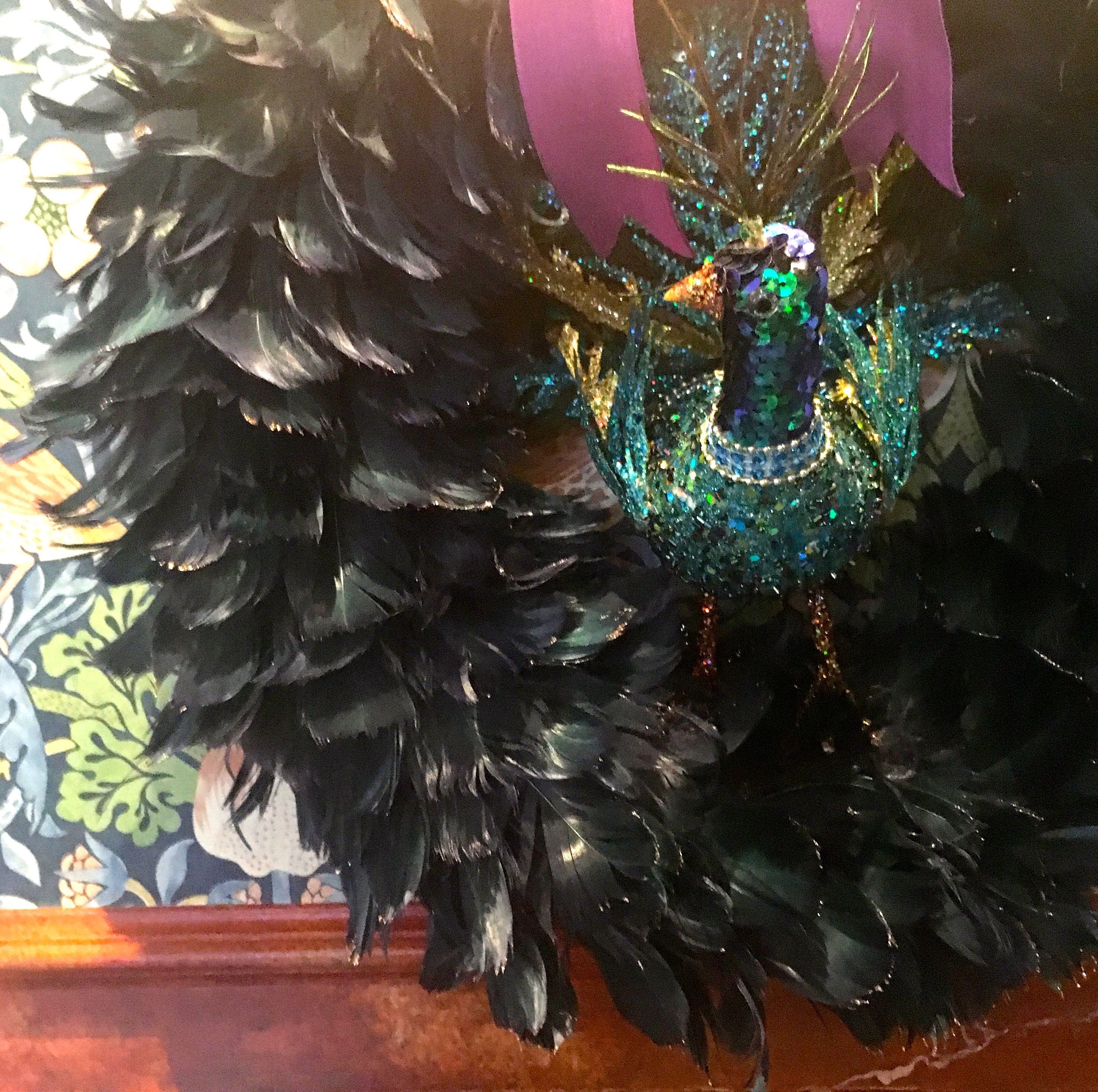 A black feather wreath with a jewelled bird from HomeSense