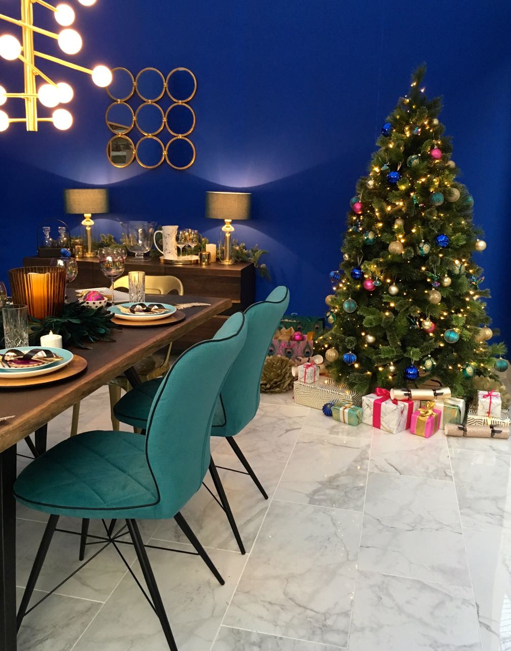 A jewelled christmas tree in this room set at the Ideal Home Show at Christmas