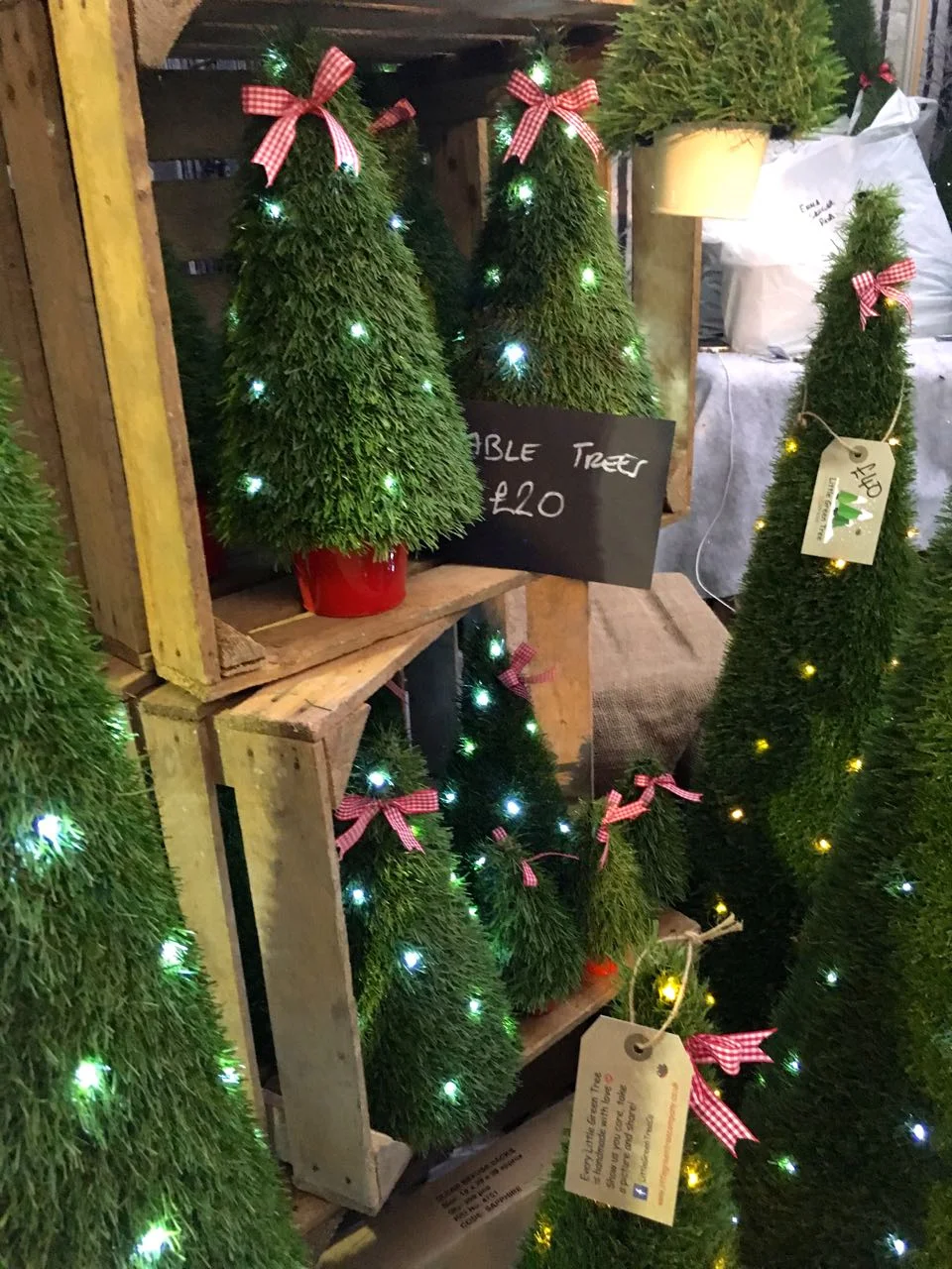 FAUX CHRISTMAS TREES OF EVERY SIZE at the Ideal Home Show at Christmas