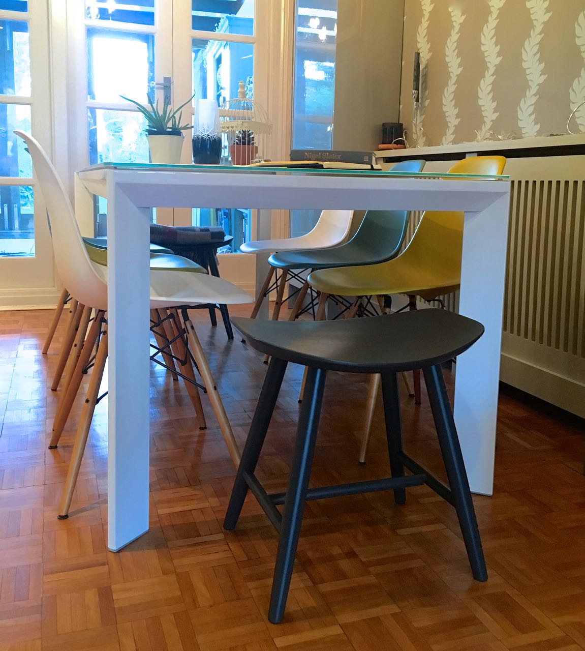With the table extended the stools are better at each end