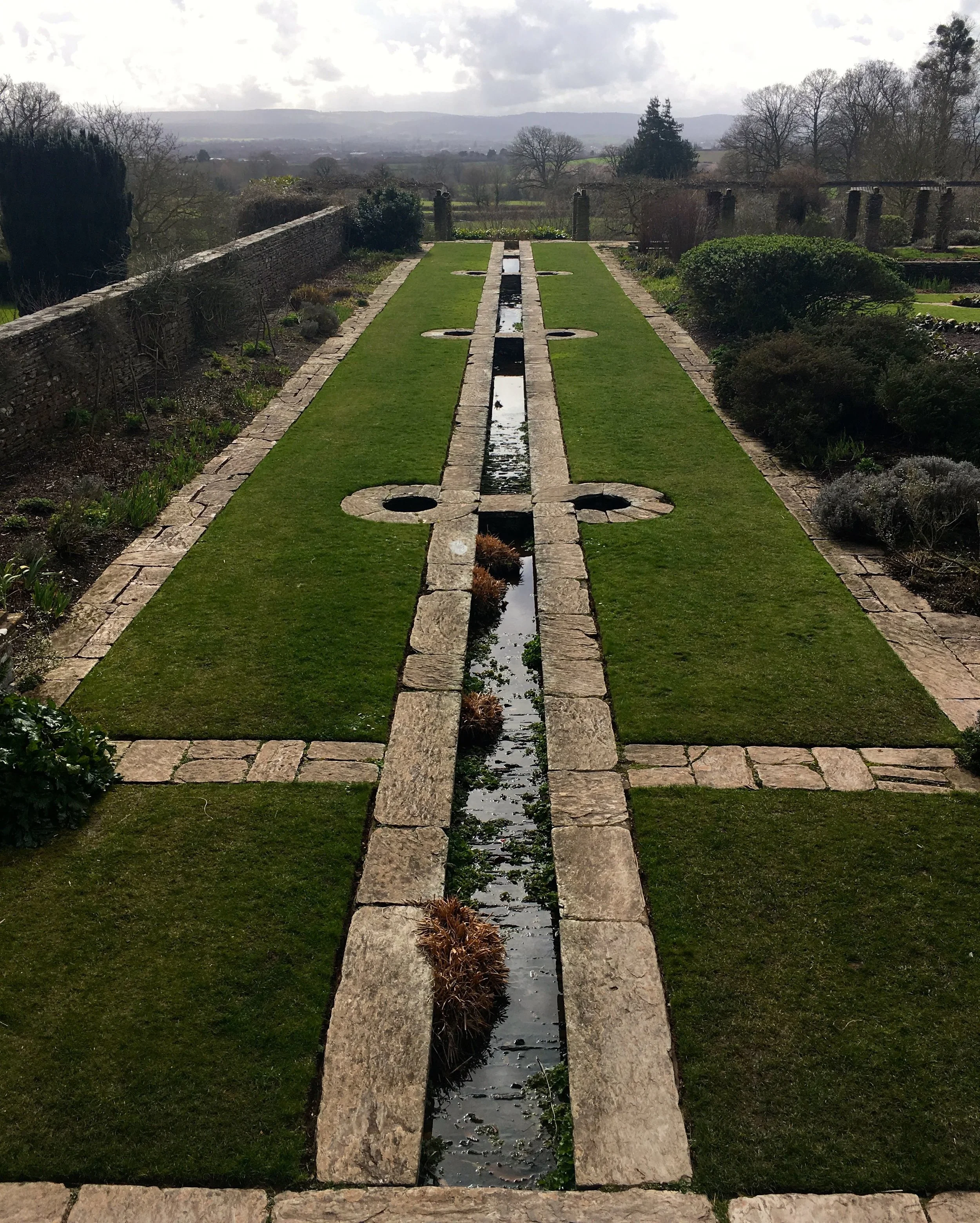 LOOKING DOWN THE GULLY OF WATER FROM THE TERRACE