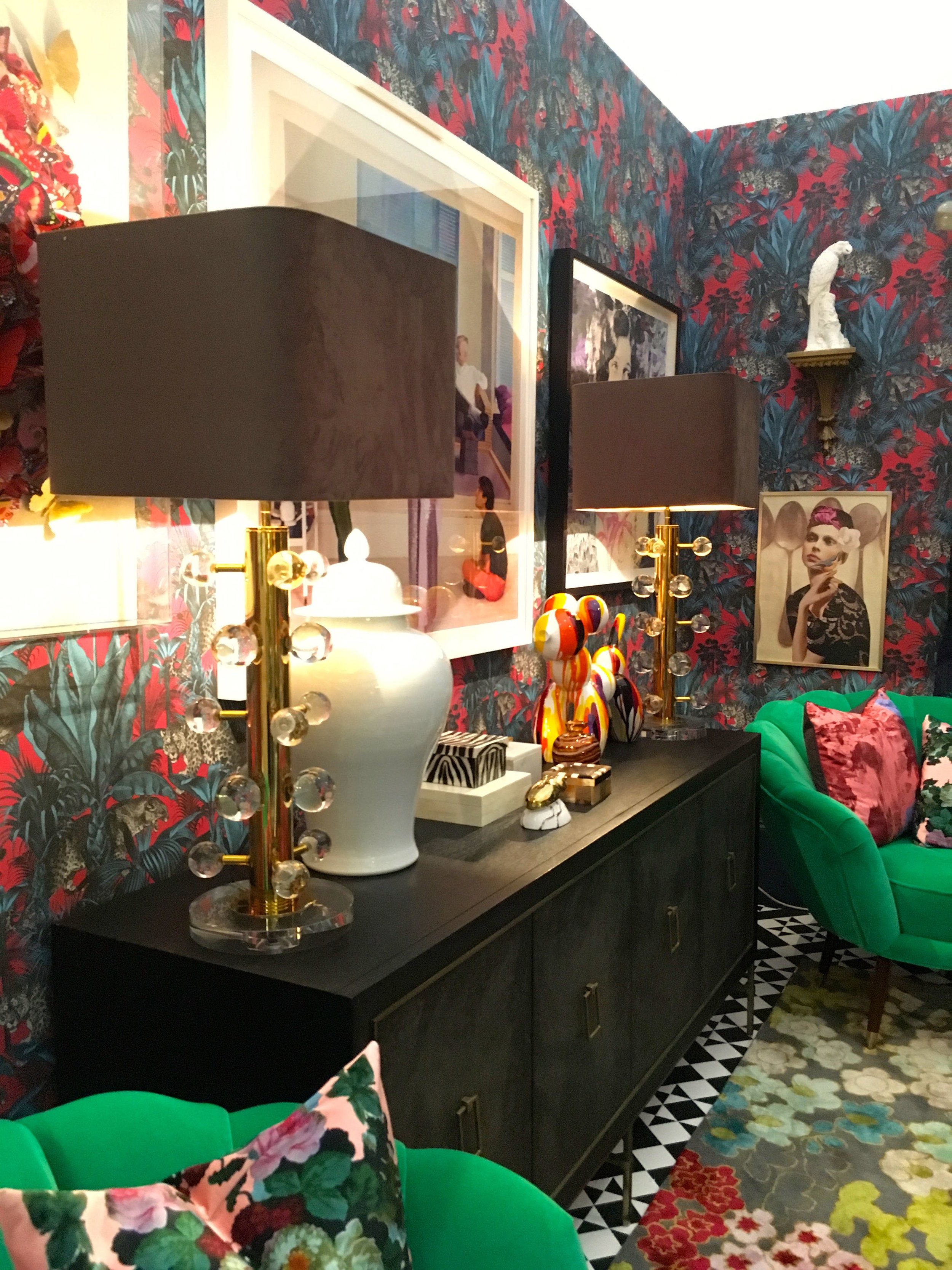 A sideboard, patterned carpet and jade armchairs in the room set from Grand Designs Live