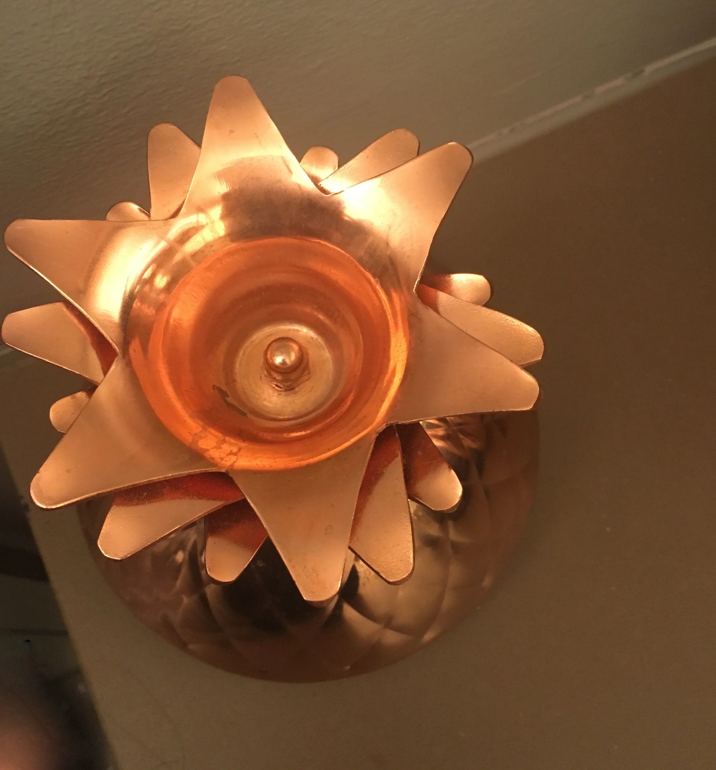 A golden pineapple lid