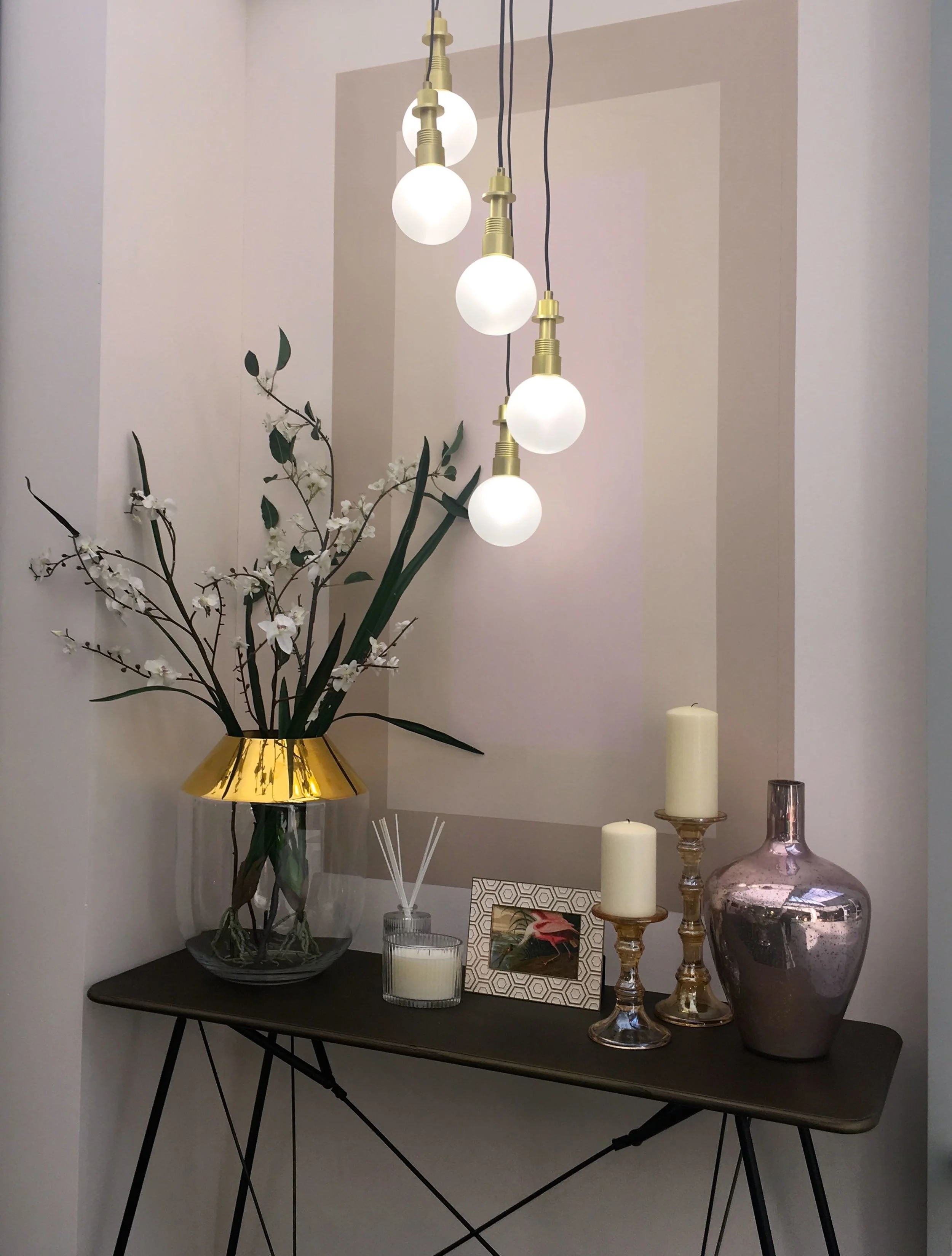 A stunning sidetable with candles and orchids
