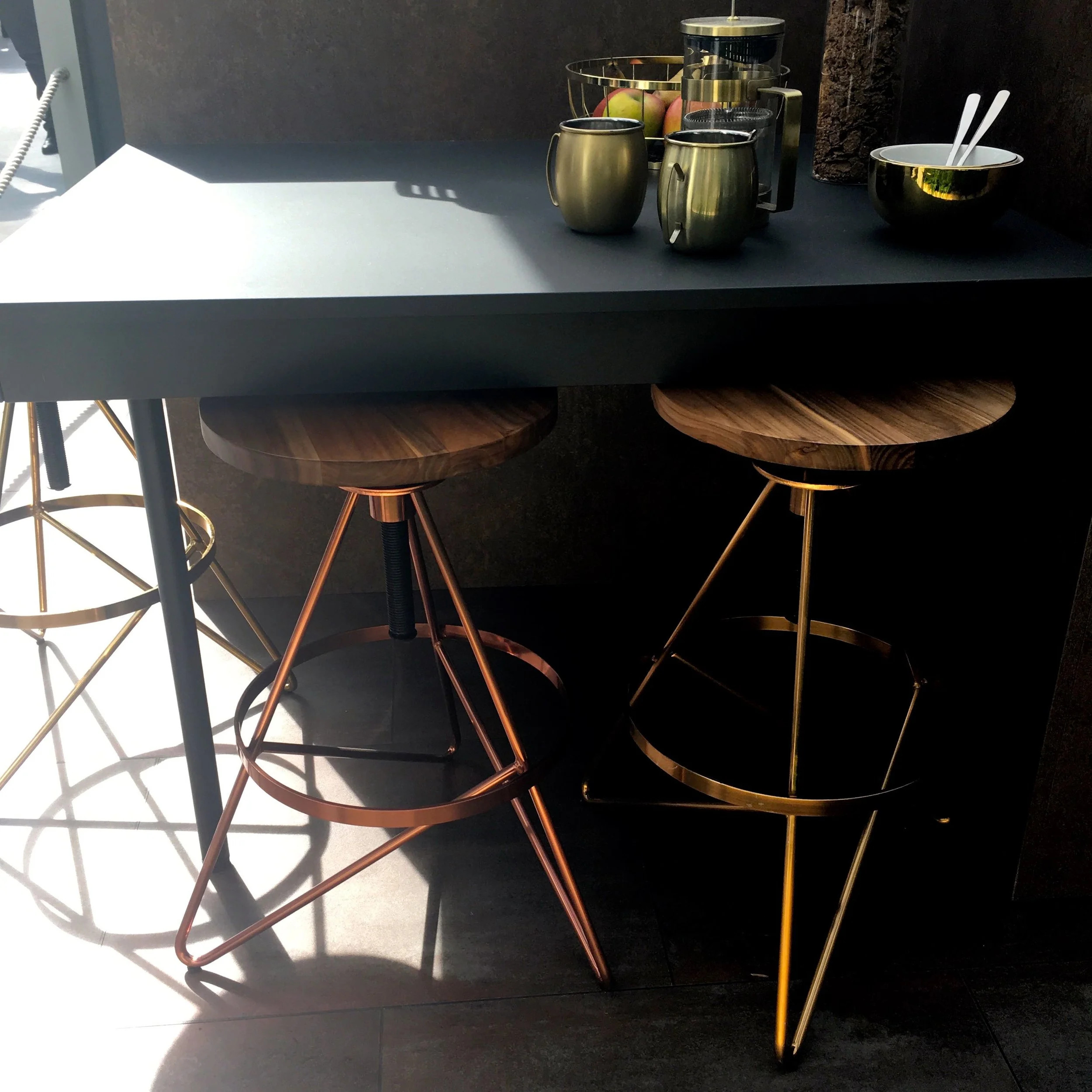 Copper and wood stools nestled under the breakfast bar