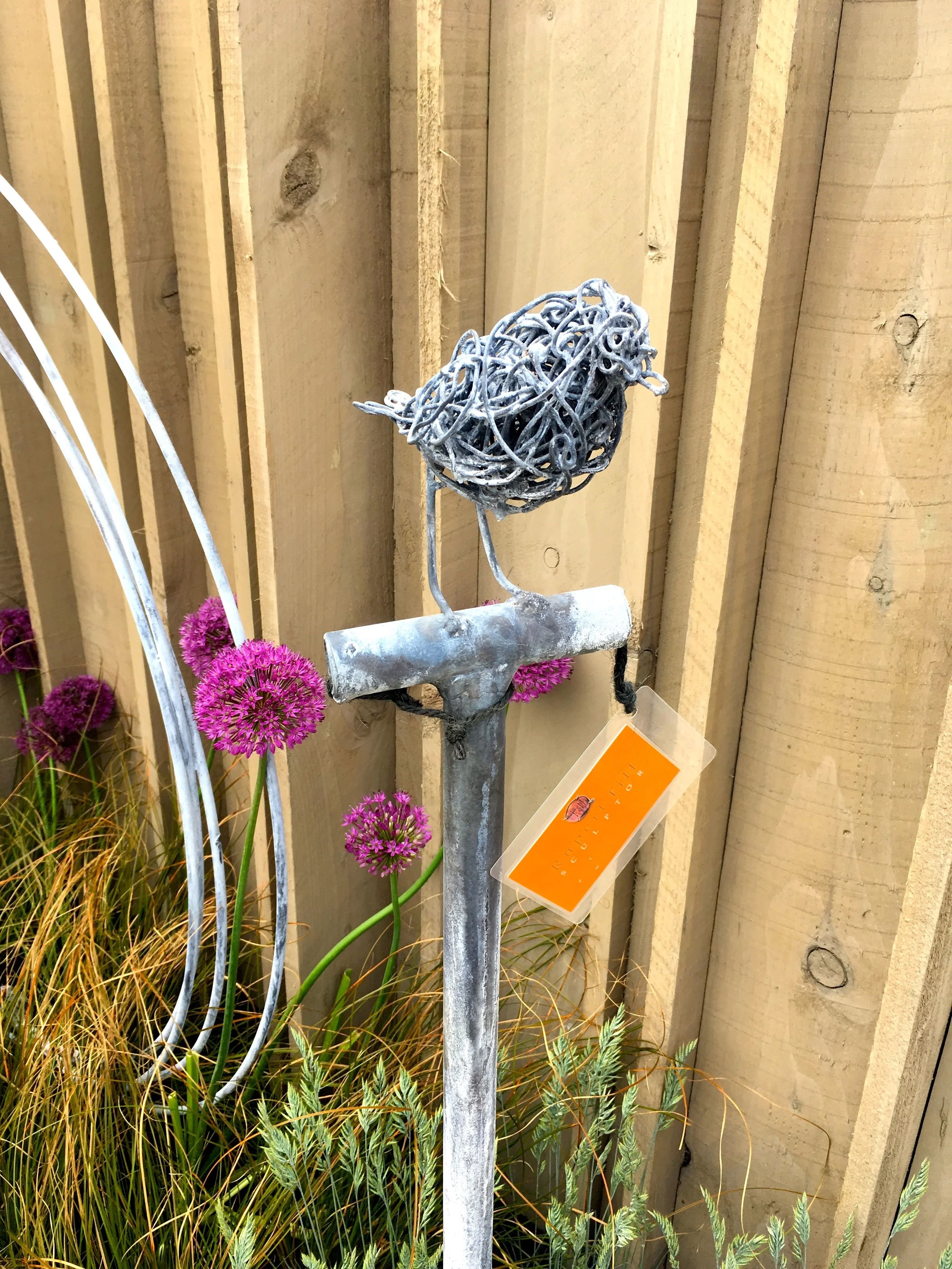 A wire robin on a spade by Robert Till