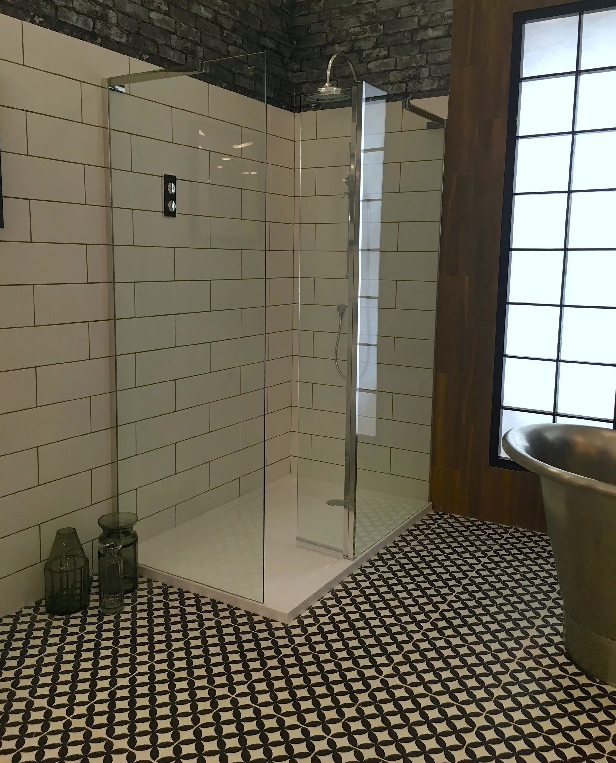 A frameless glass walk in shower