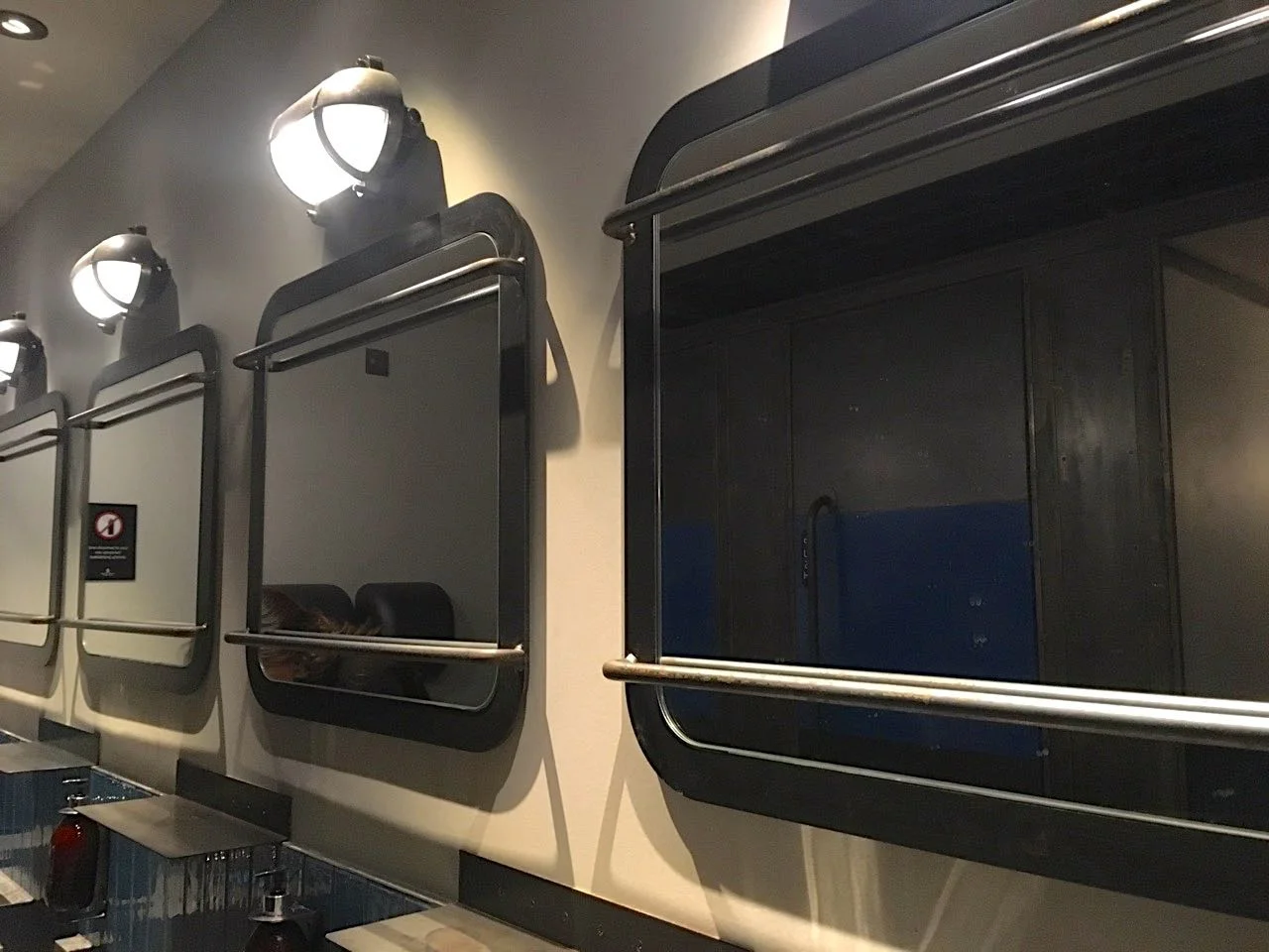 a row of uniform mirrors