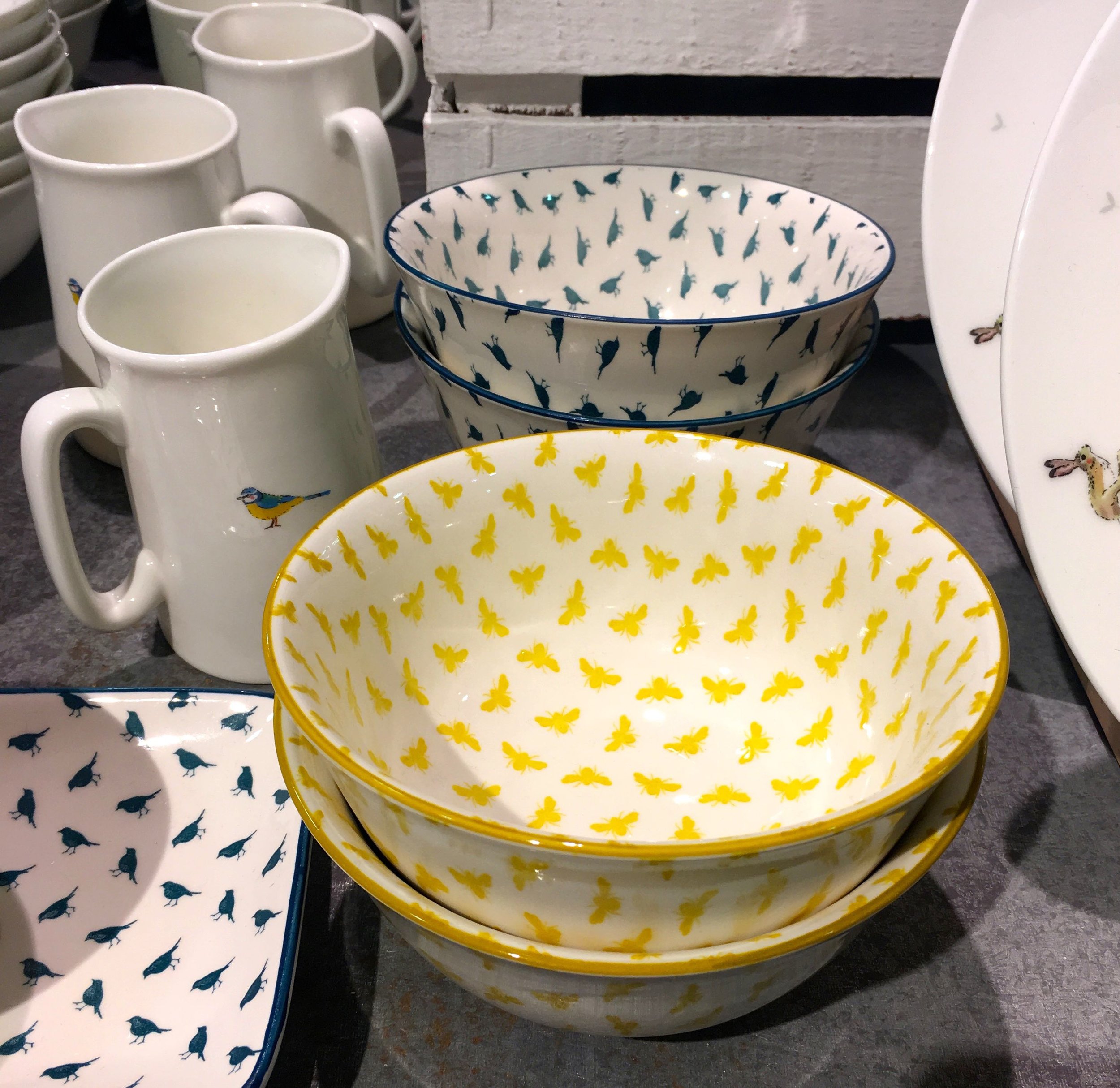 small repeating patterns, yellow butterflies, teal birds