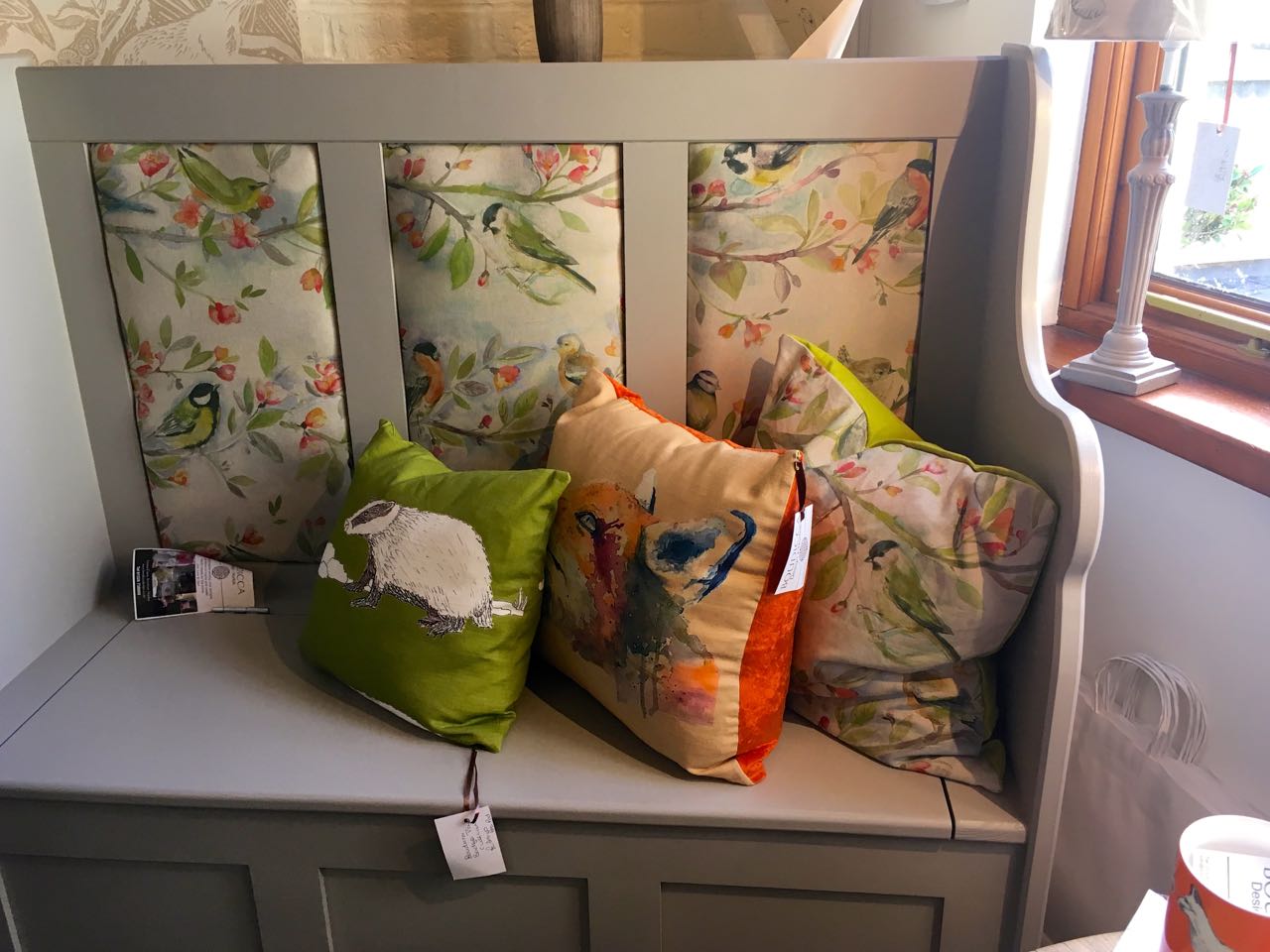 Cushions and a padded settle